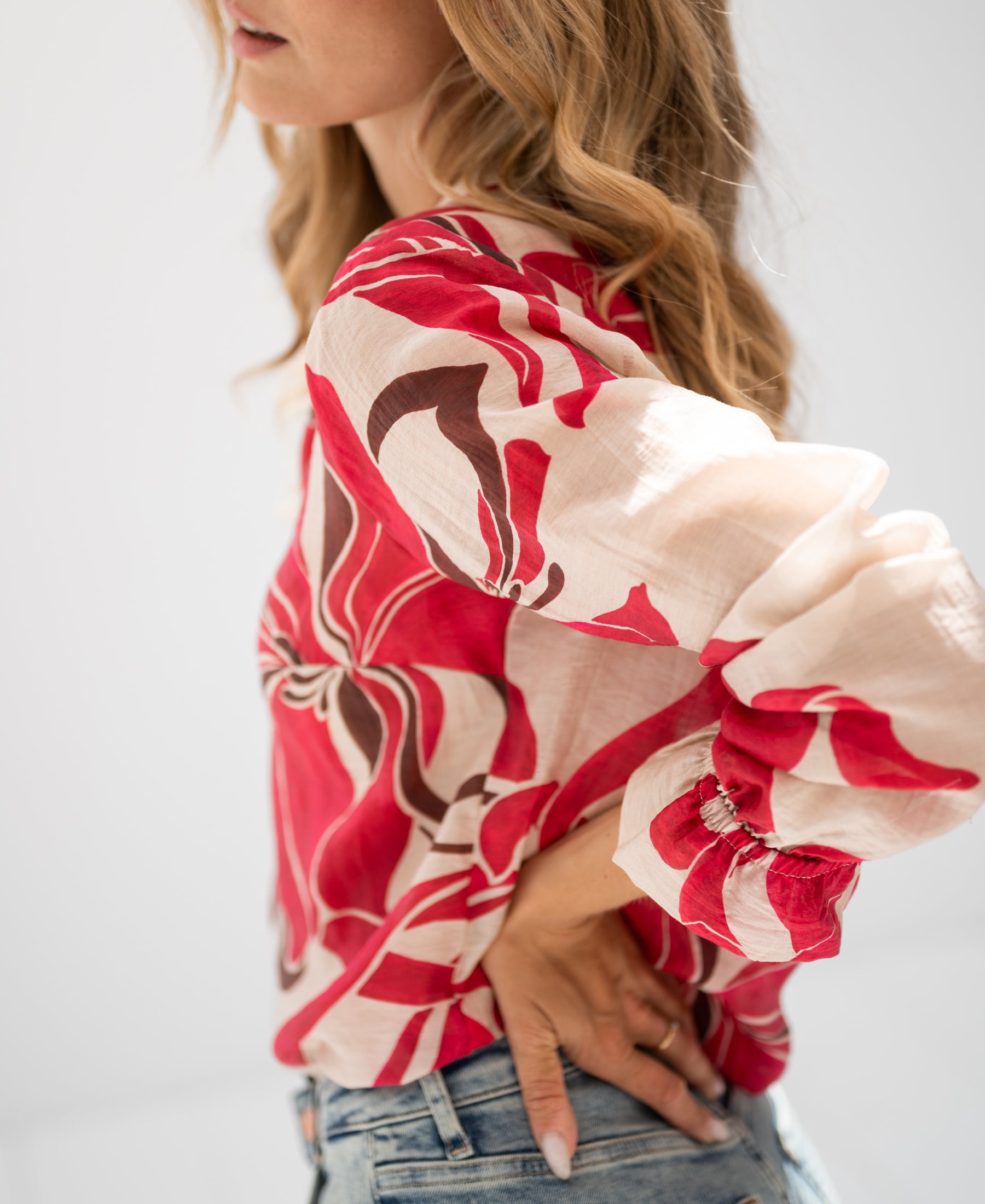 Ruby Red print LA BINOCLE blouse shown, long sleeves, front view.