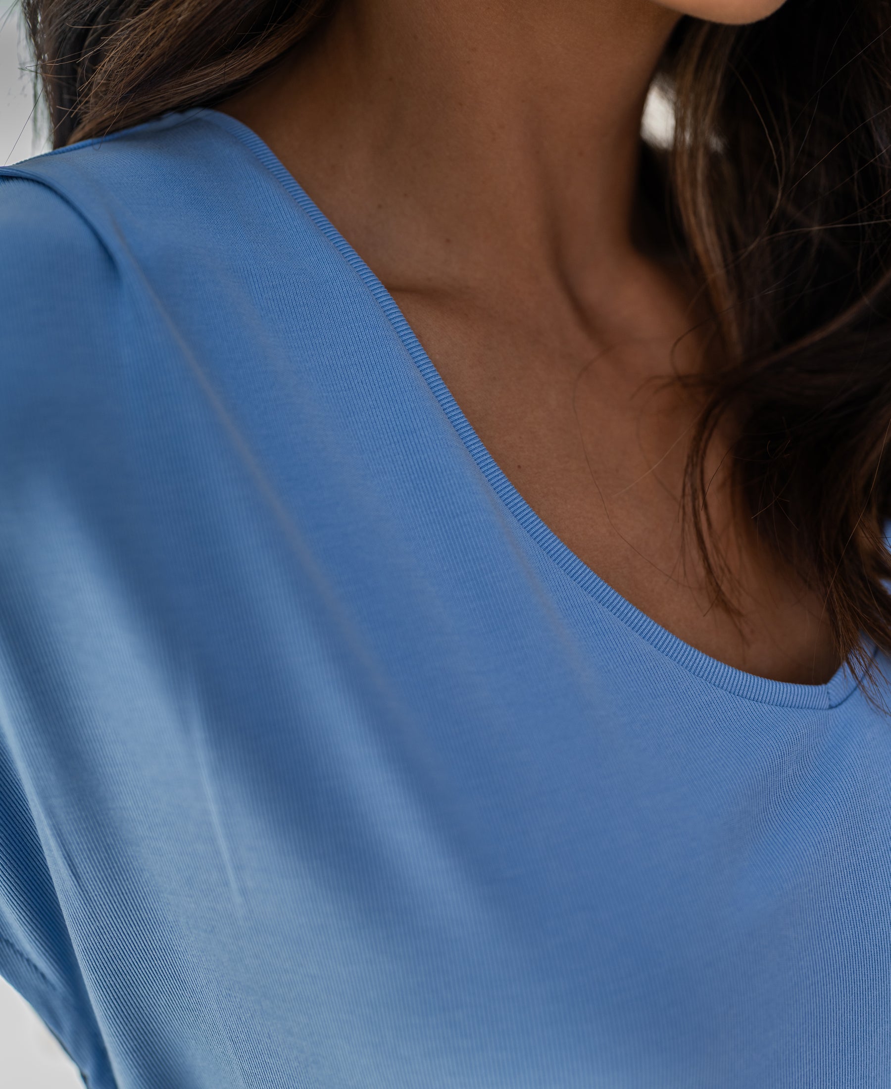 Close-up of the Plein Publique ribbed light blue T-shirt, showing the neckline and fabric texture.