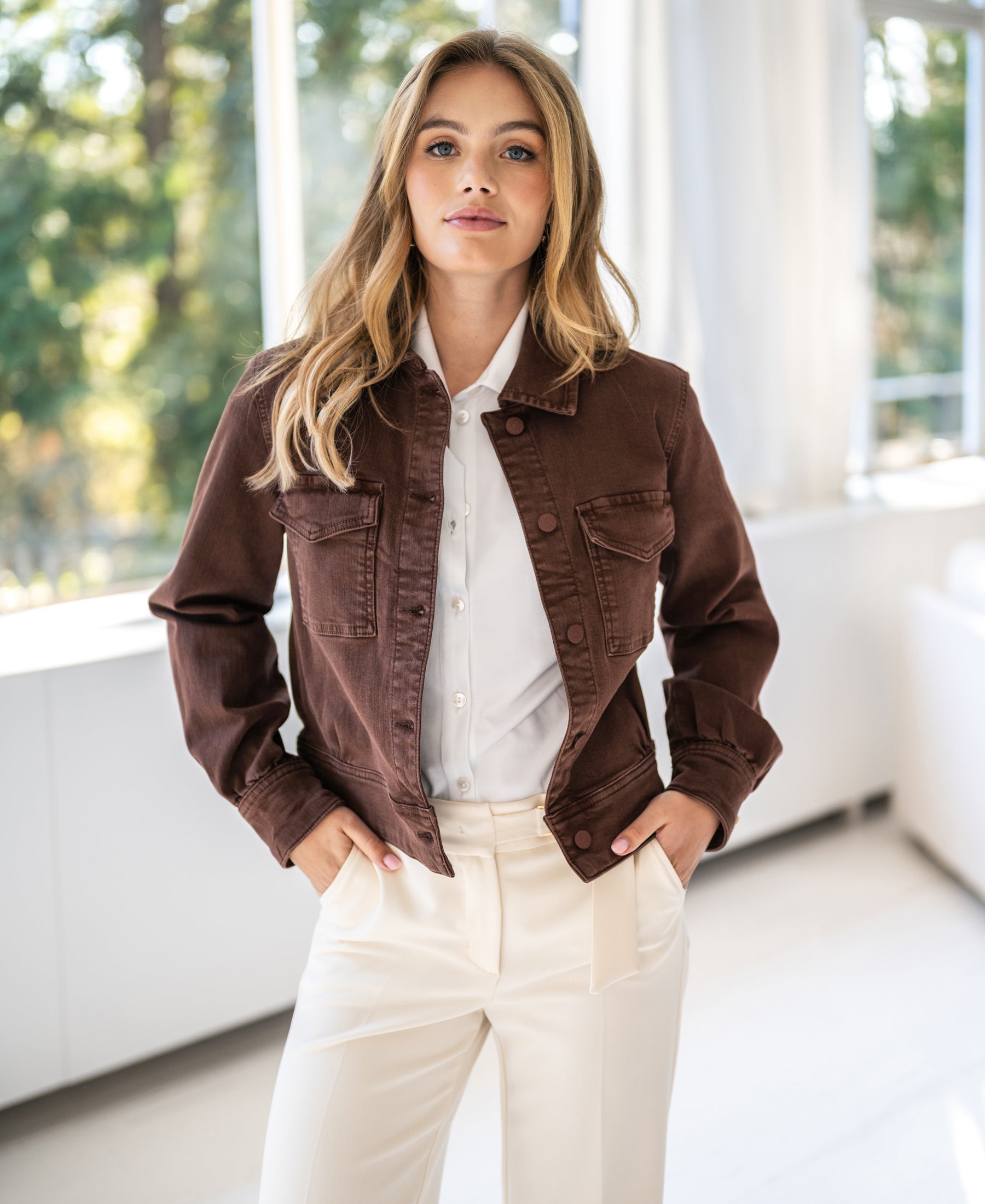 Stretch denim jacket in cacao brown displayed indoors.