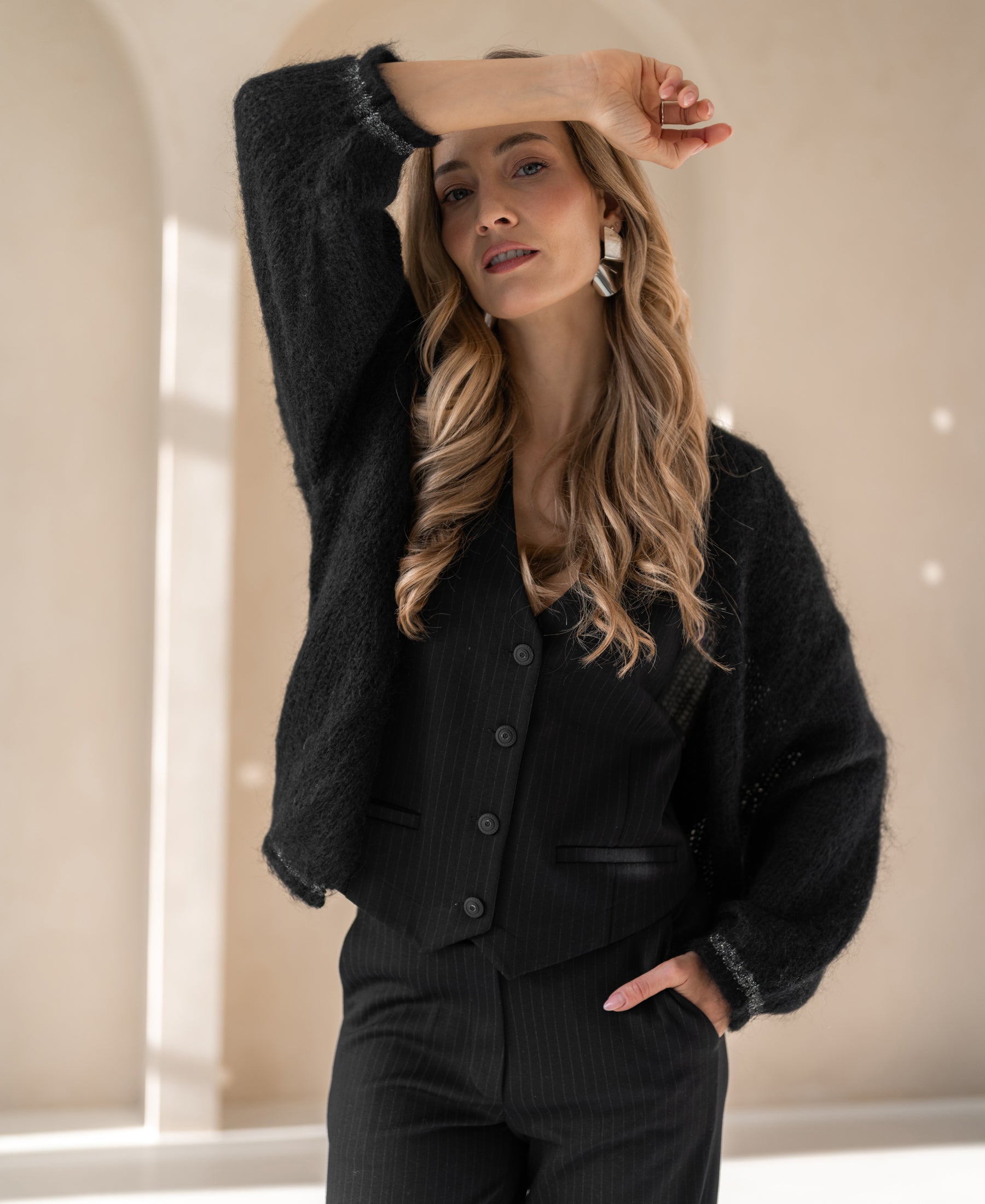 Black fluffy vest LA CHERIE by Plein Publique, shown on a model.