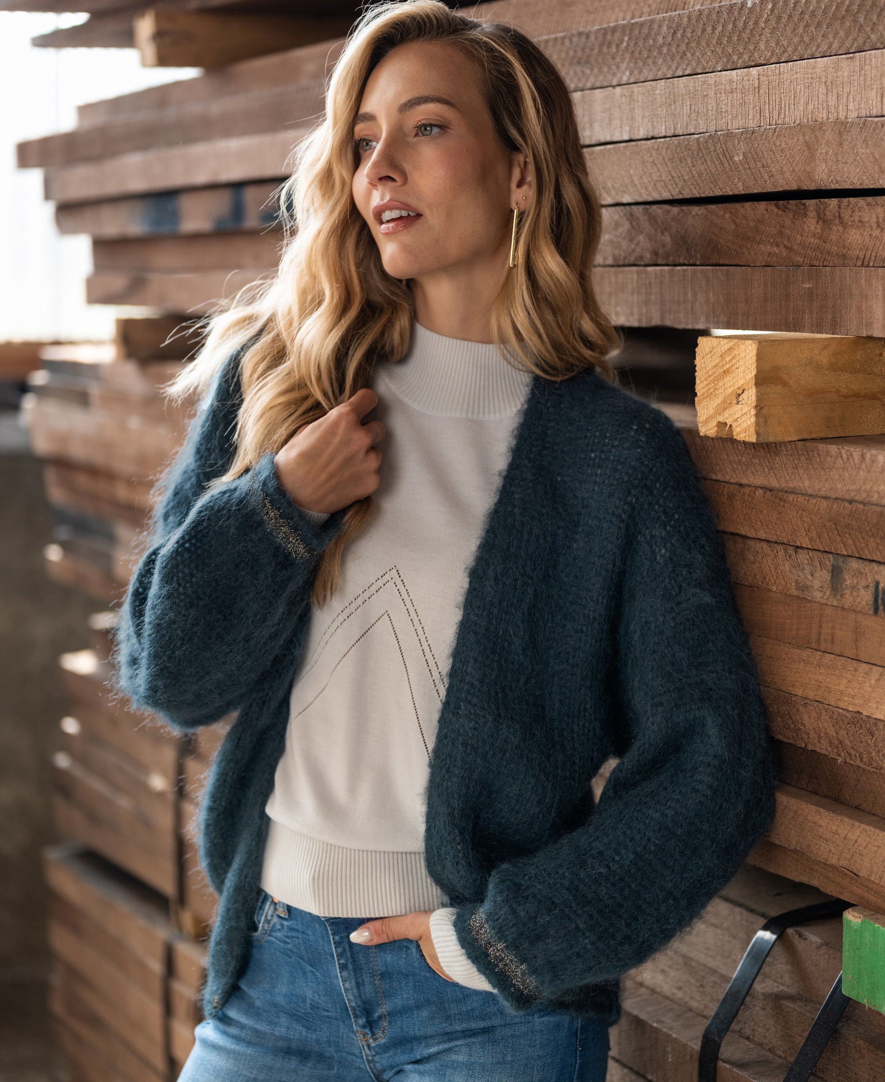 Woman wears the PLEIN PUBLIQUE Fluffy Vest LA CHERIE in dark mist green.