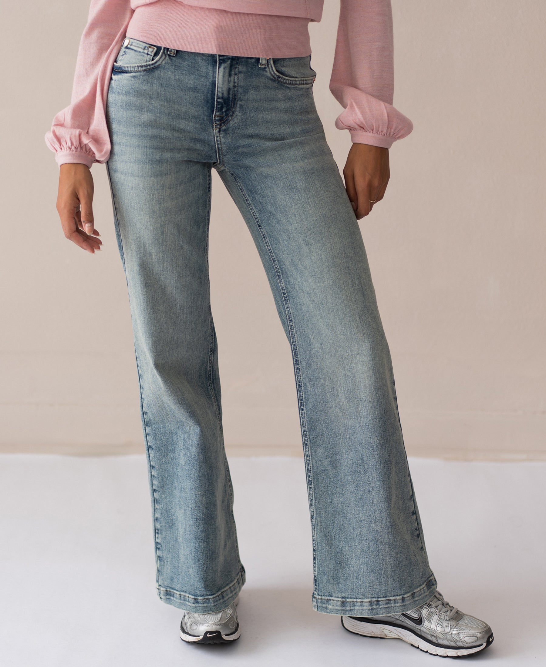 Wide leg vintage jeans by Les Deux against a plain background.