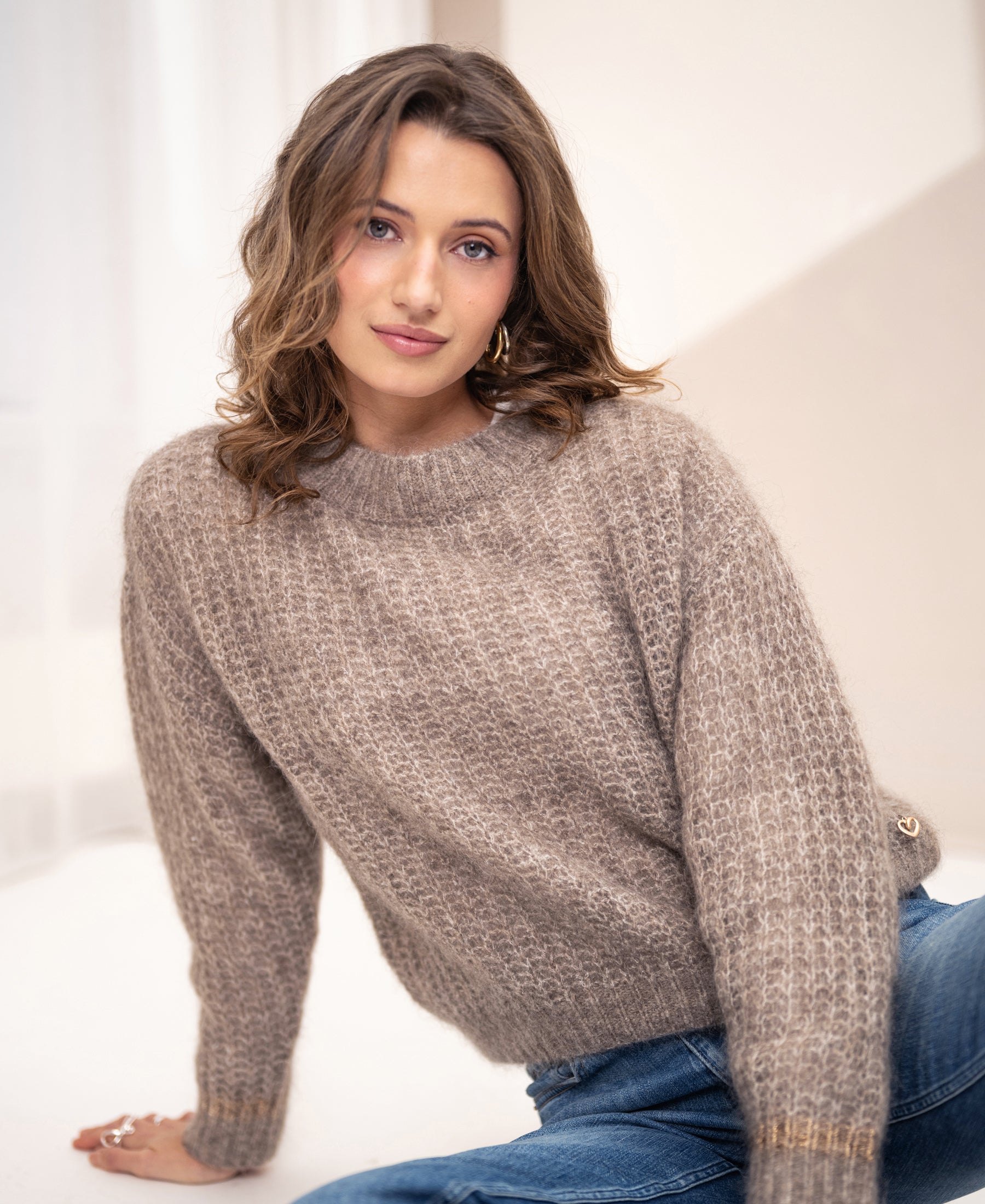 Sand-colored mohair sweater by PLEIN PUBLIQUE, shown indoors.