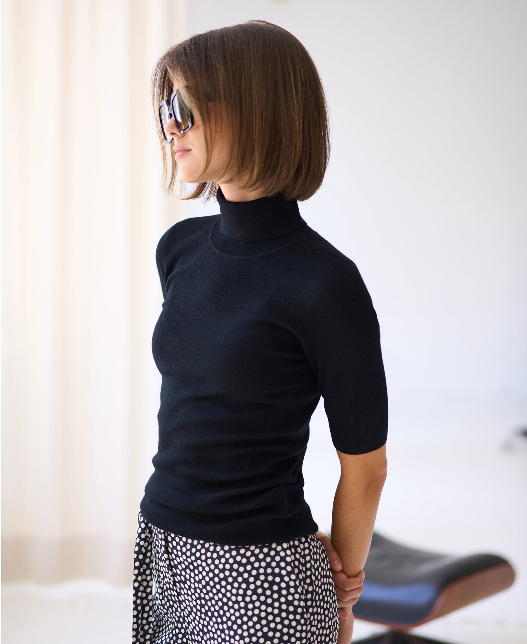 Black short-sleeve turtleneck sweater.