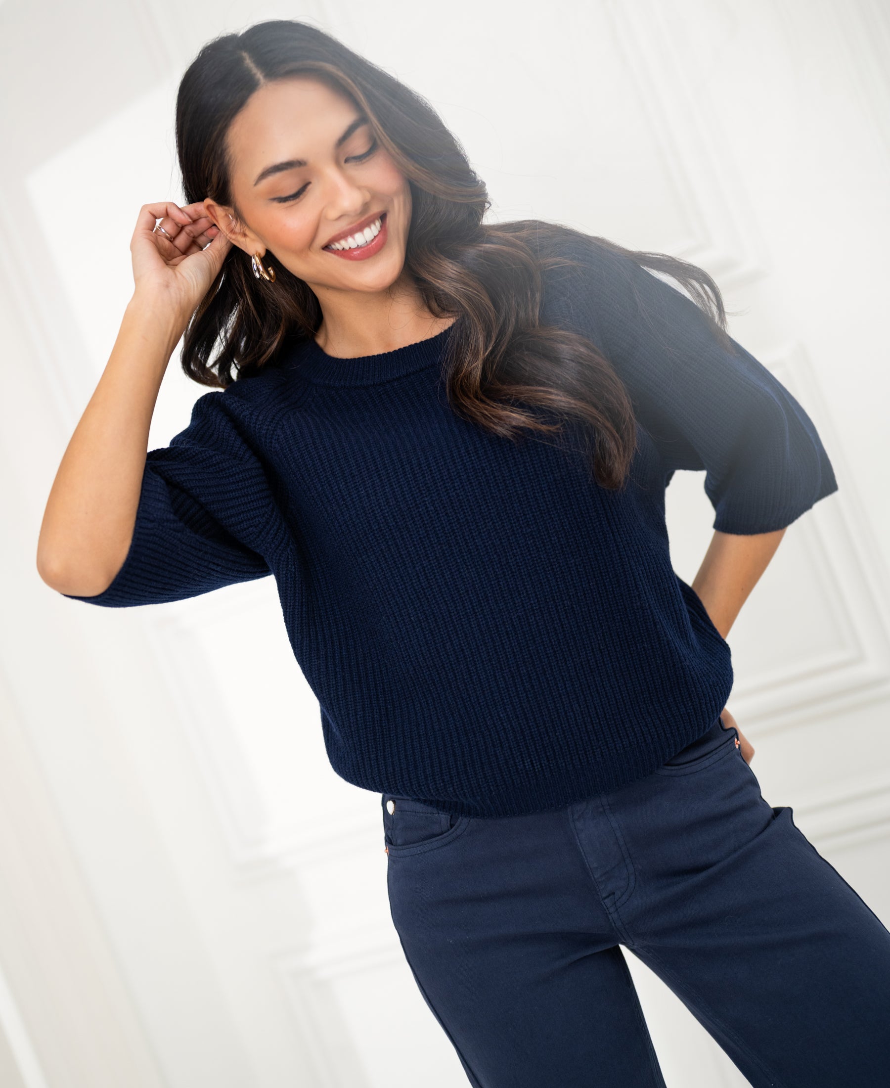 Navy blue PLEIN PUBLIQUE LA FRAMBOISE sweater shown in a bright room.
