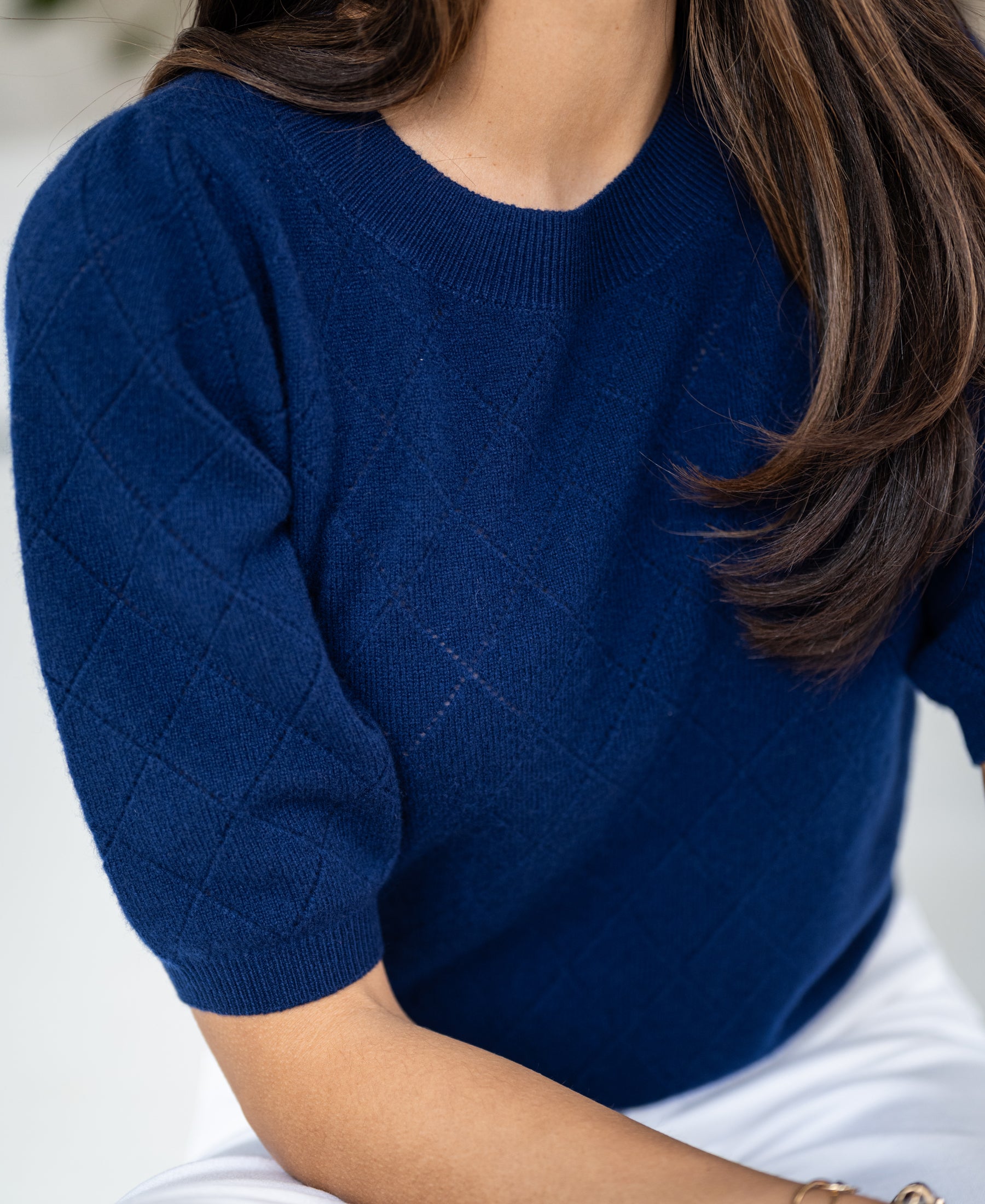 Navy argyle merino wool sweater with "Le Harvard" design.