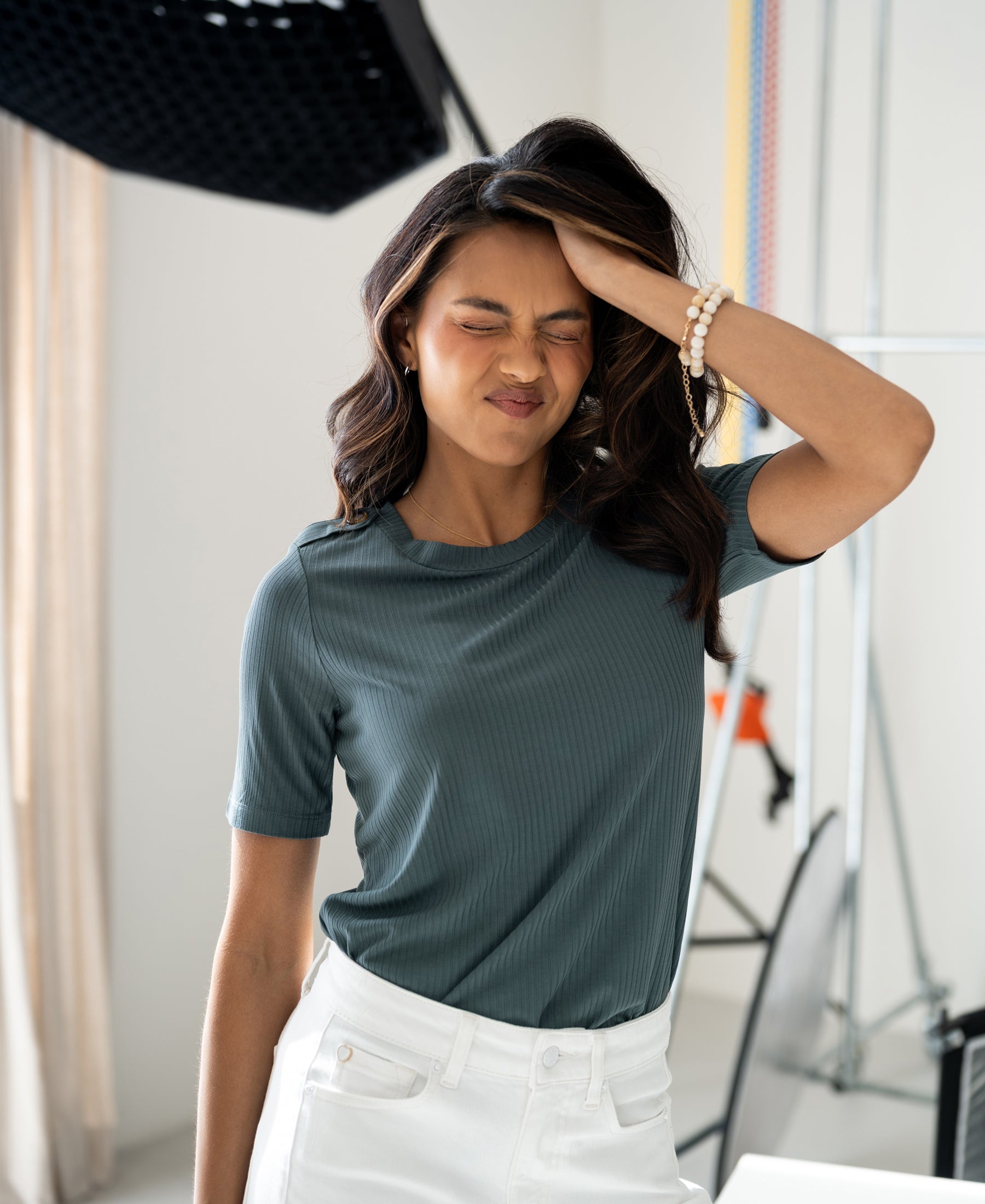 Mist green bamboo t-shirt in a bright room.