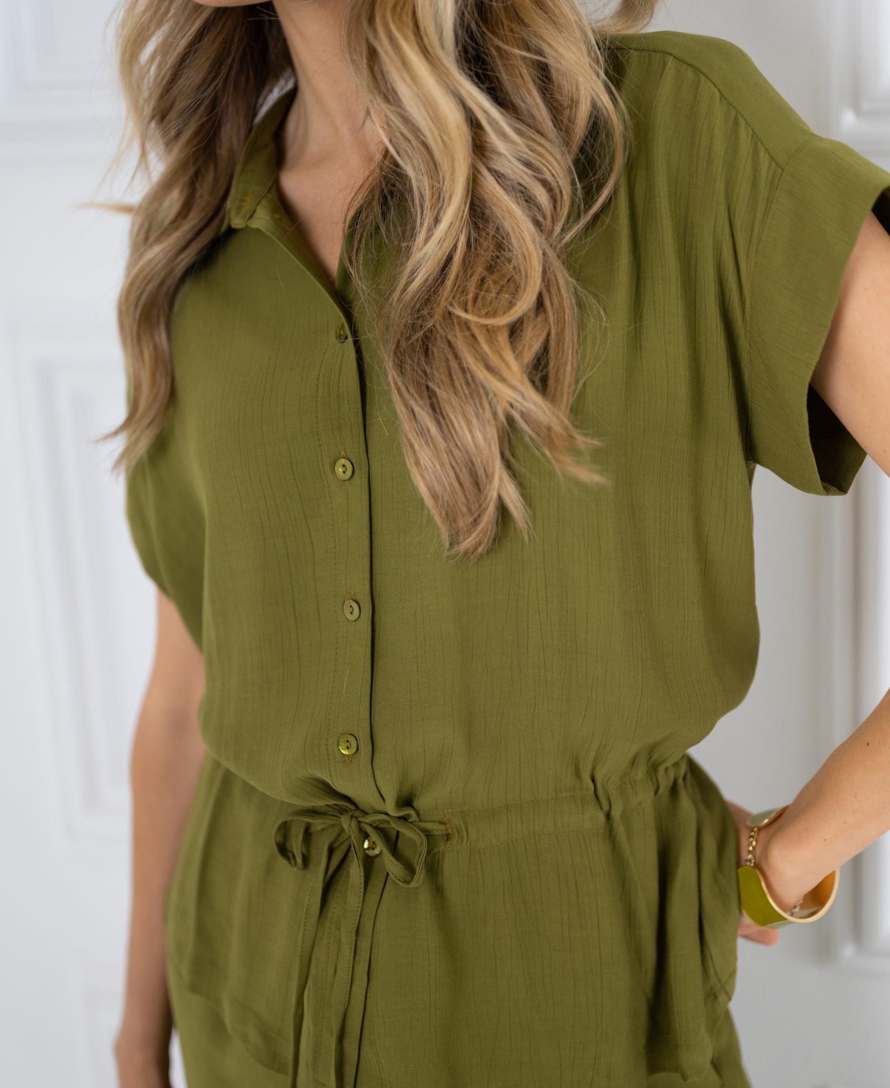 Olive green blouse by PLEIN PUBLIQUE, shown against a white background.