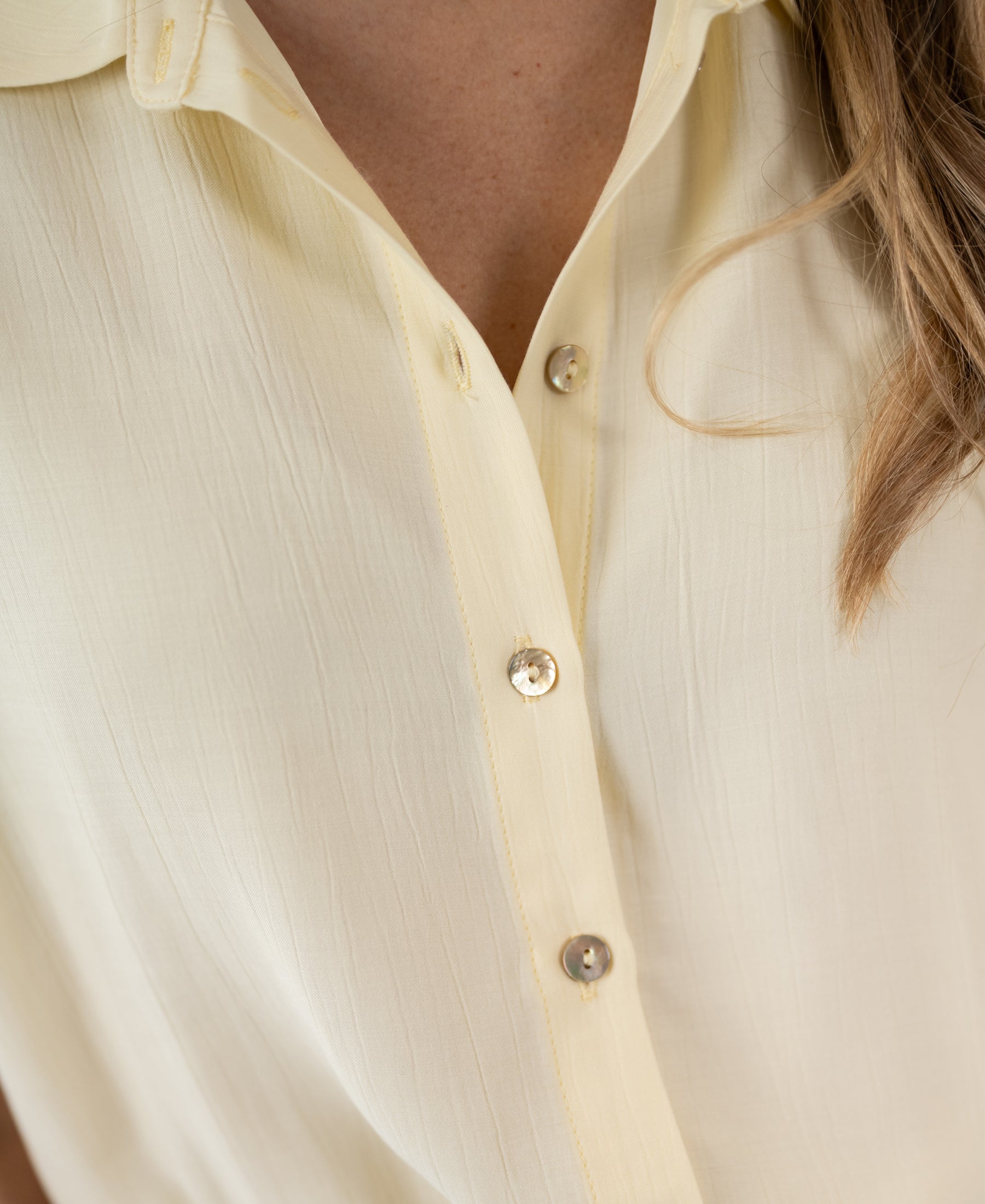 Close-up of Plein Publique LA JODY soft yellow blouse.