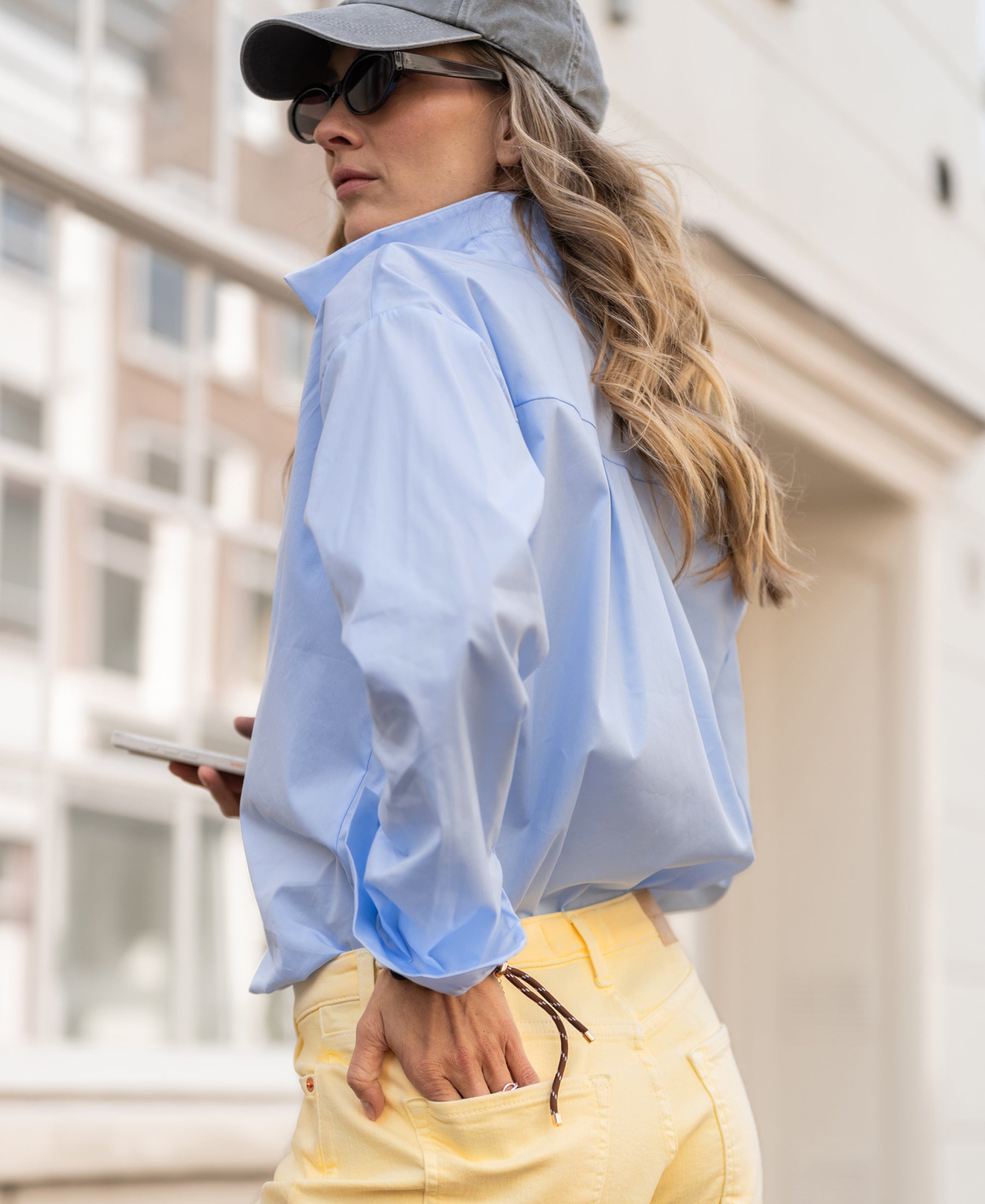 Oversized light blue blouse, LE LILLE, shown on a woman.