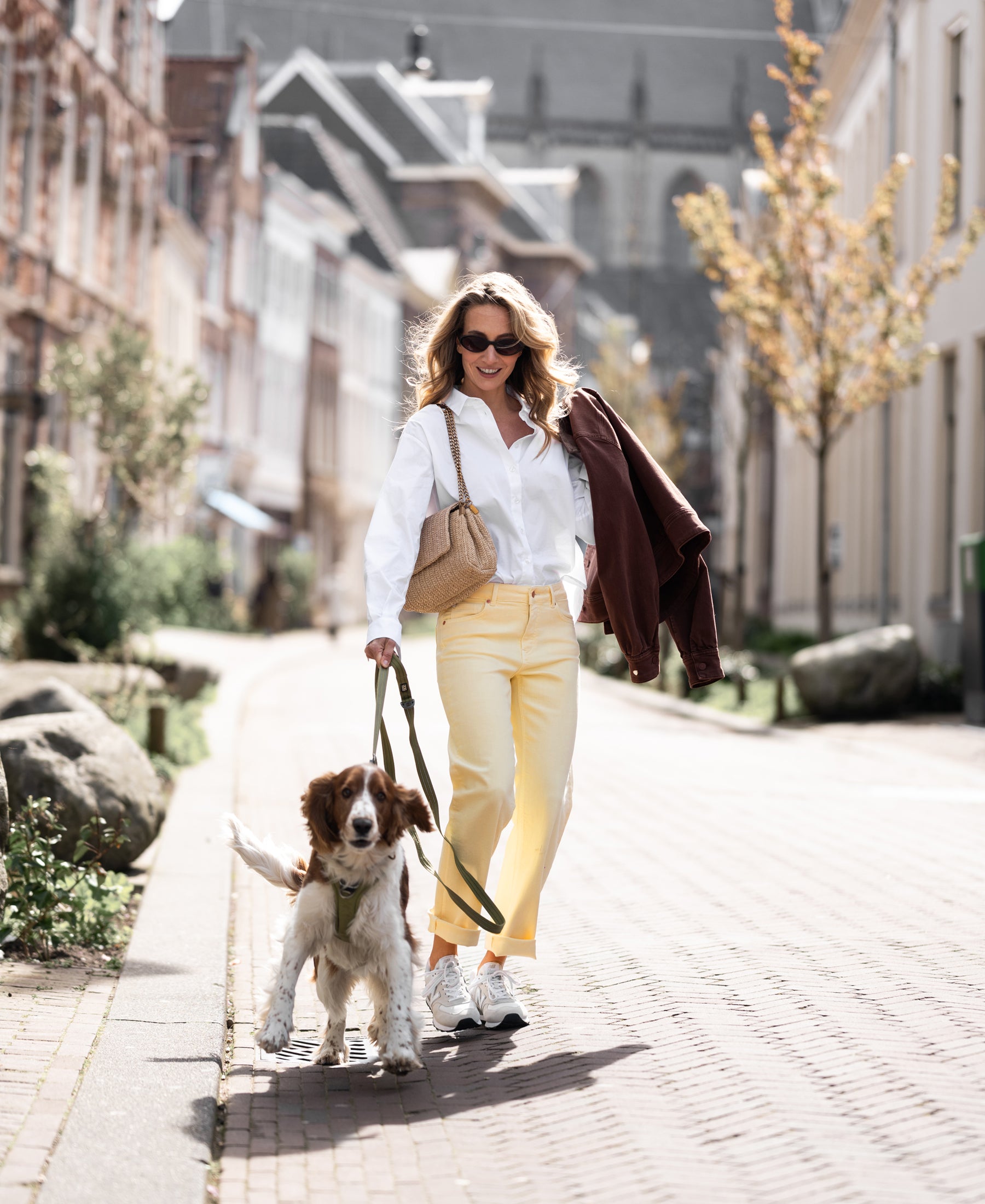 Woman wearing Plein Publique cropped jeans in soft yellow, front view.