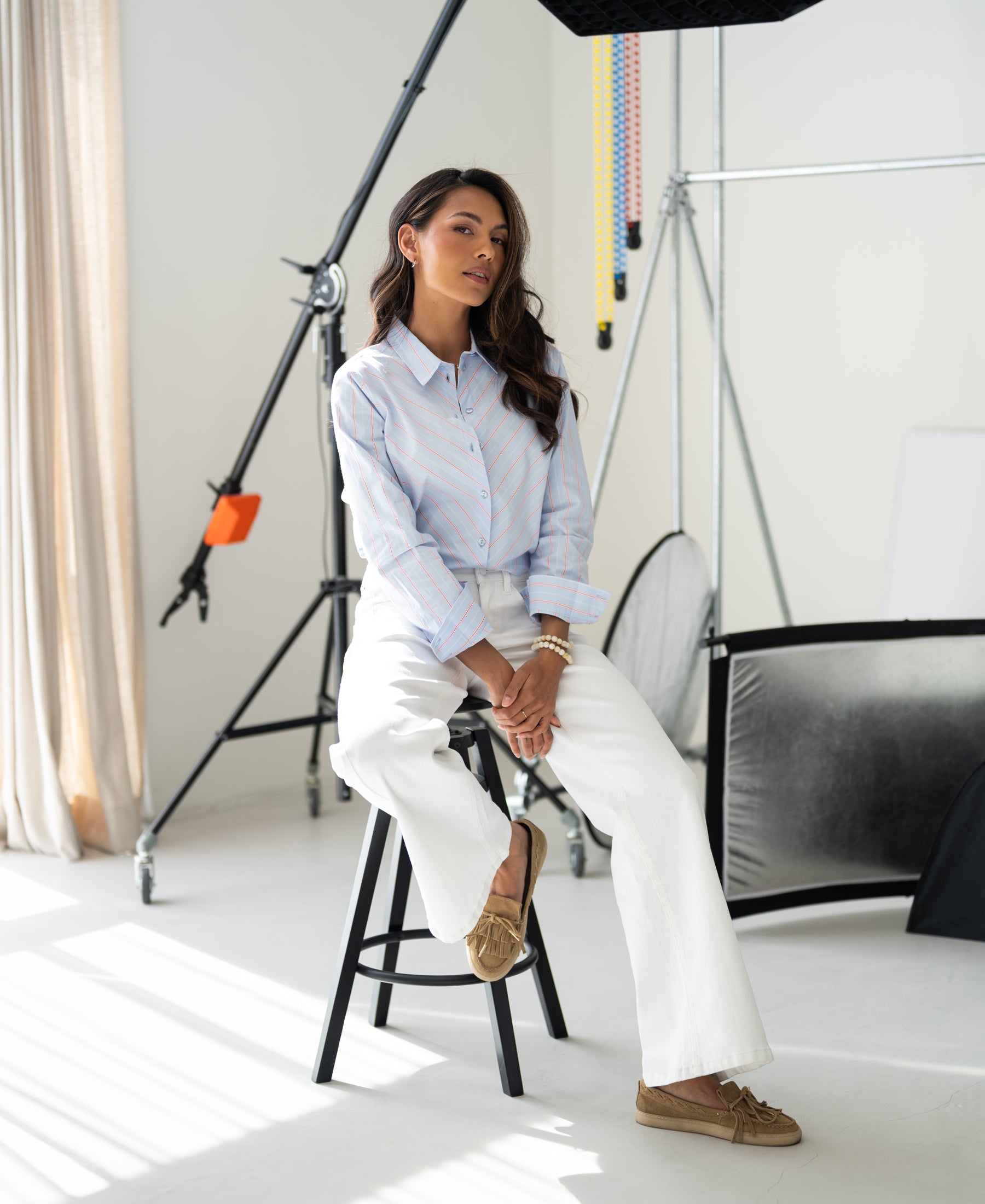 Striped blouse LA LOIRE in light blue-coral displayed in a brightly lit studio.