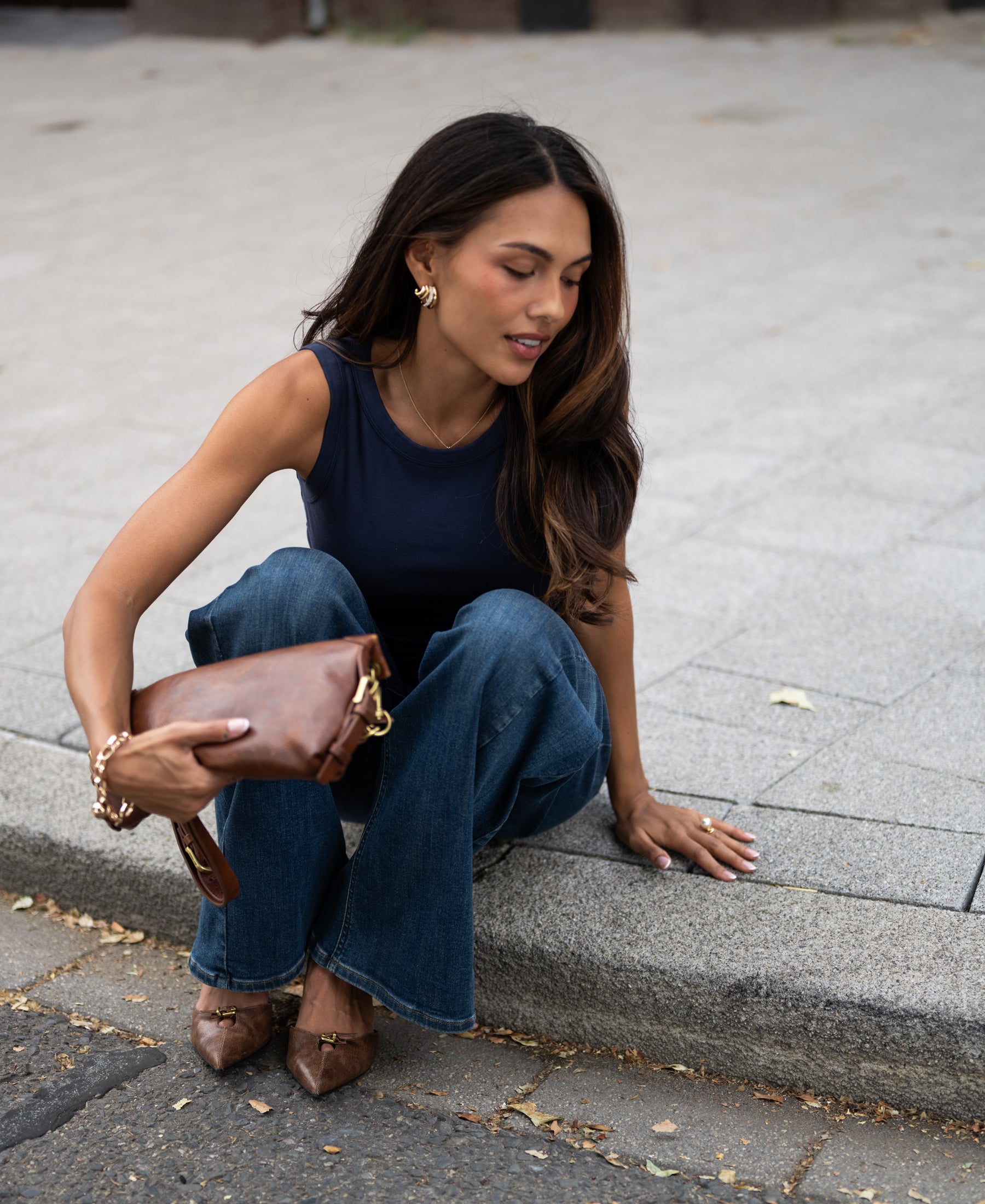 Woman wearing a dark blue PLEIN PUBLIQUE luxurious and soft boat neck top.