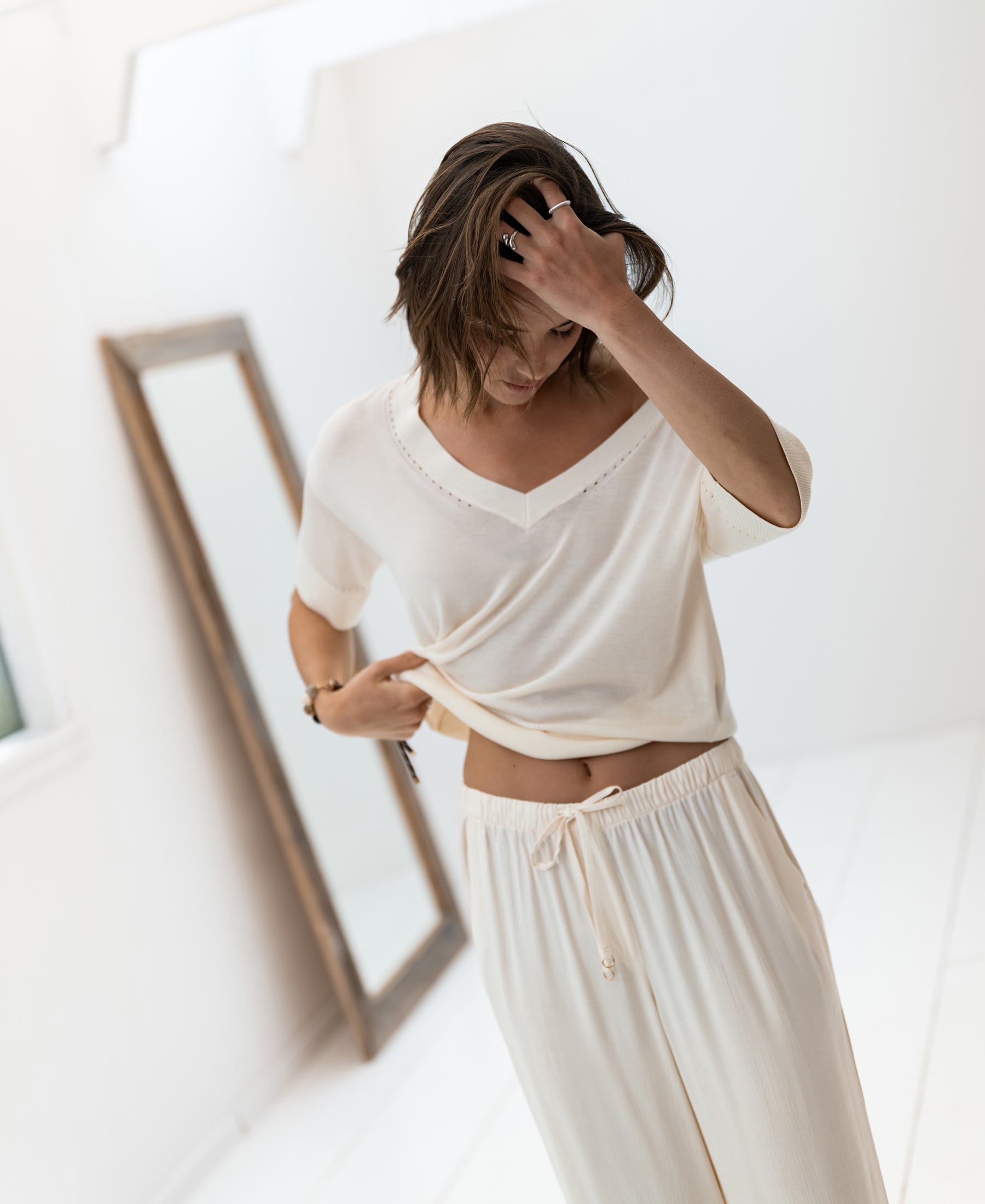 Cream silk blend LE MARDY top by PLEIN PUBLIQUE shown indoors.