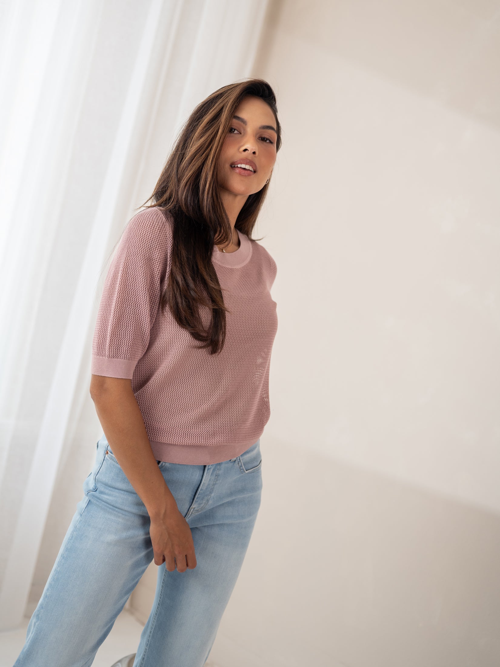 Dusty pink mesh sweater with silk by PLEIN PUBLIQUE shown indoors.