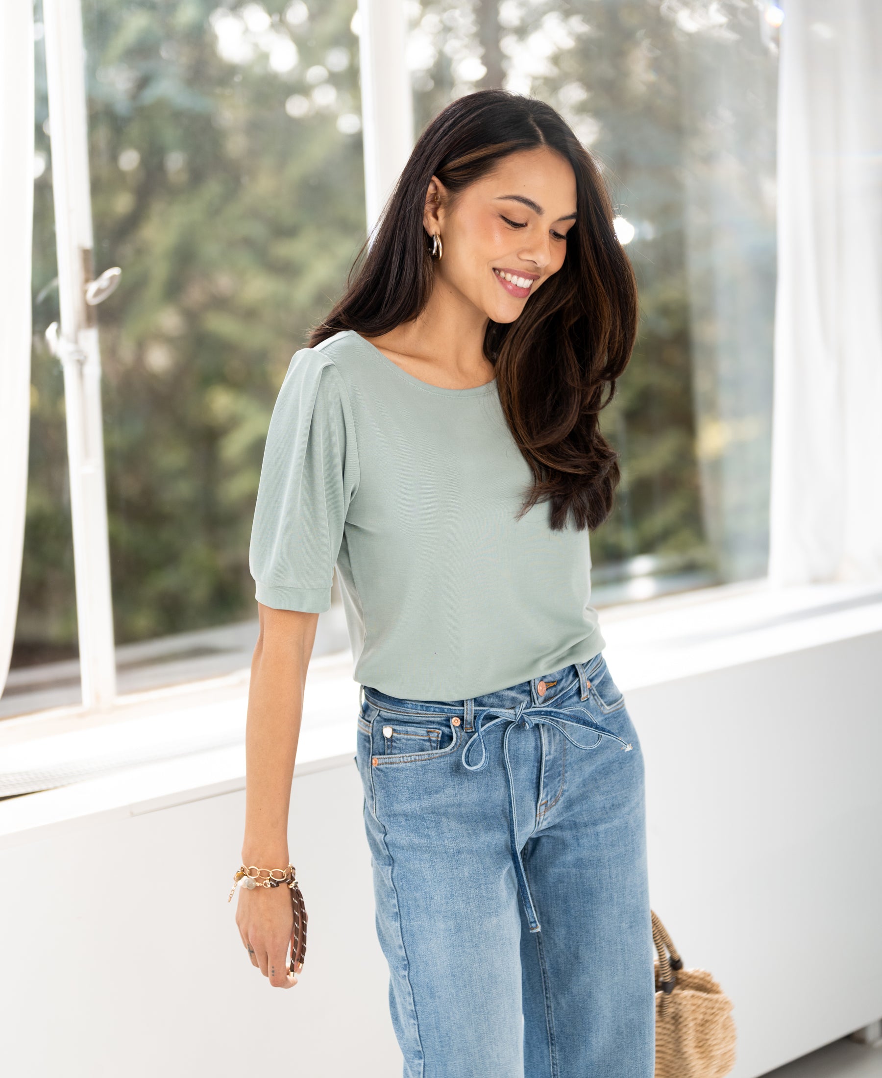 Ribbed T-shirt LA PHILEINE in mint green from PLEIN PUBLIQUE, shown near large windows.