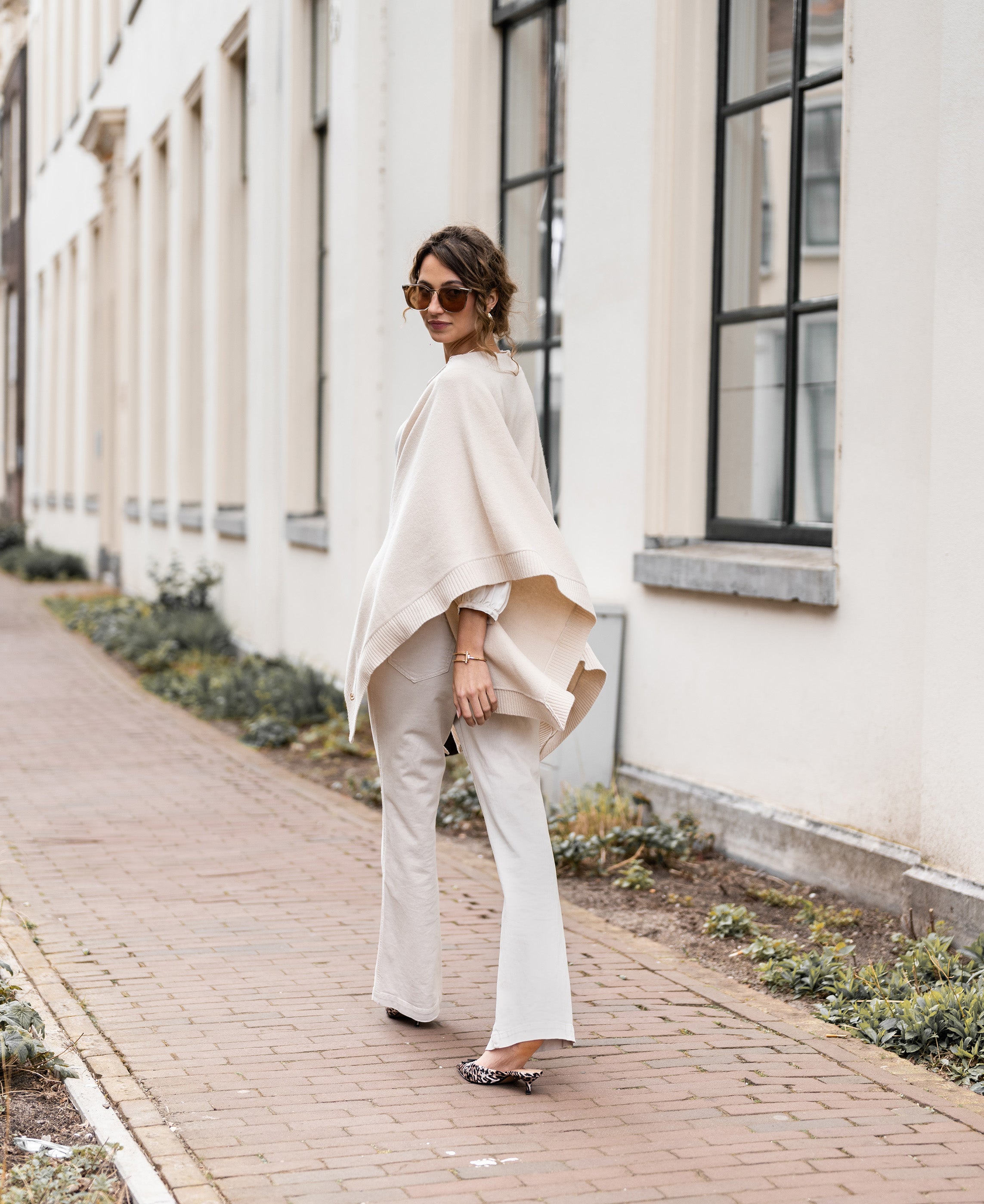 Light sand merino wool poncho, rear view.