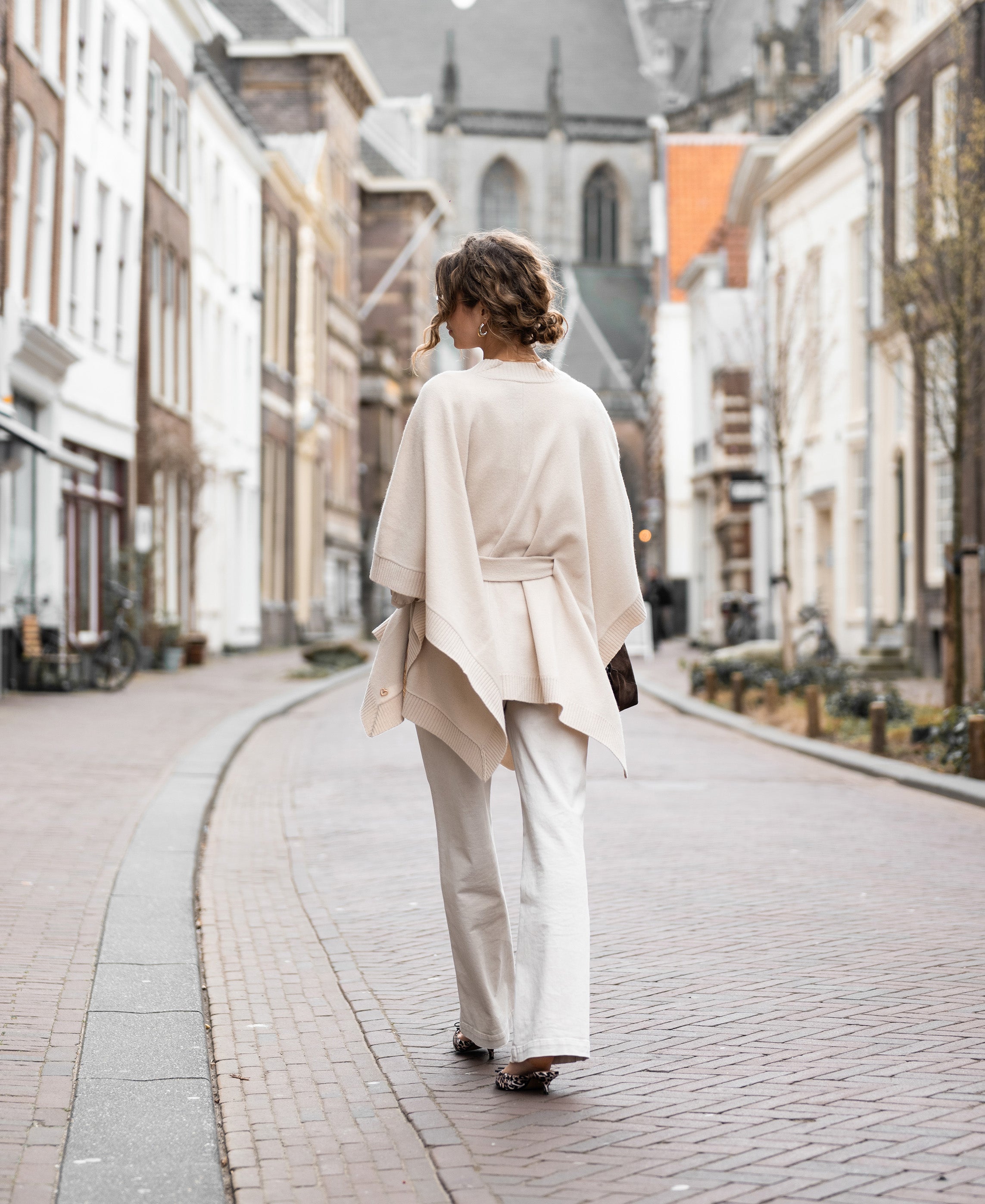 Light sand-colored merino wool poncho from Plein Publique.