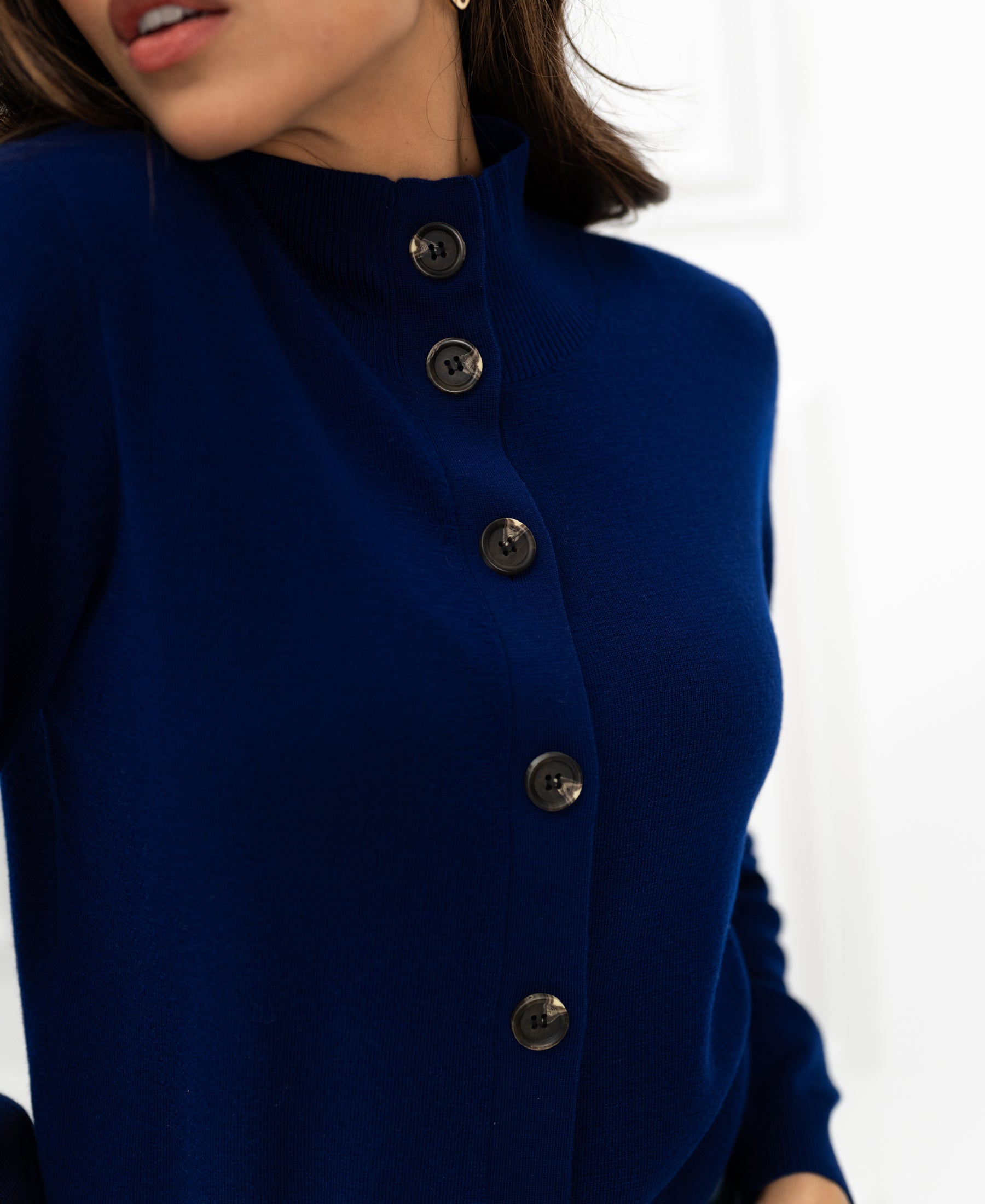 Navy merino wool vest shown from shoulders to waist.