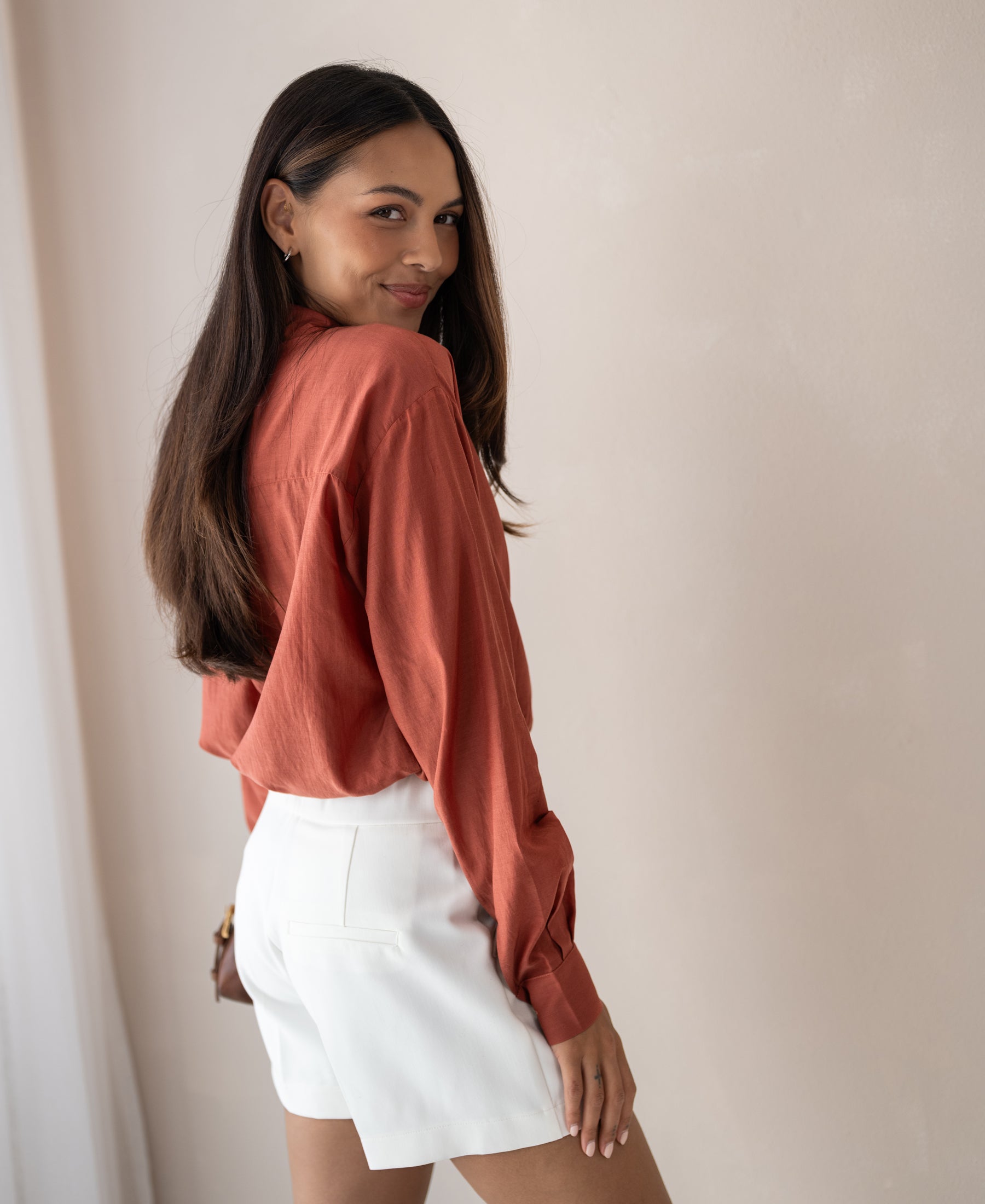 Dunne oversized blouse in Terra silk by PLEIN PUBLIQUE, shown indoors.