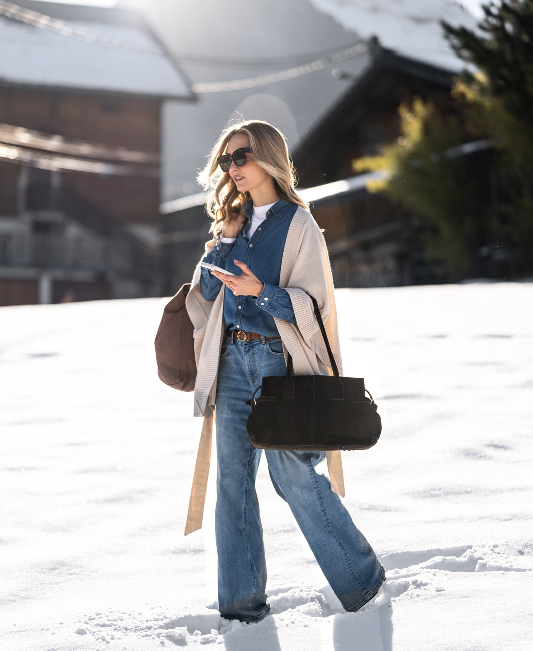 Stonewash Tencel denim blouse by SOLD OUT shown outdoors.