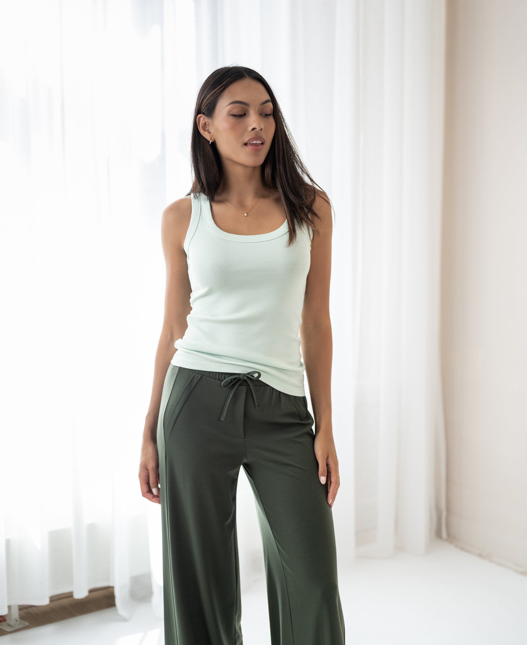 Pastel green PLEIN PUBLIQUE luxury soft top, LA TOULON style, shown in a well-lit room with white curtains.