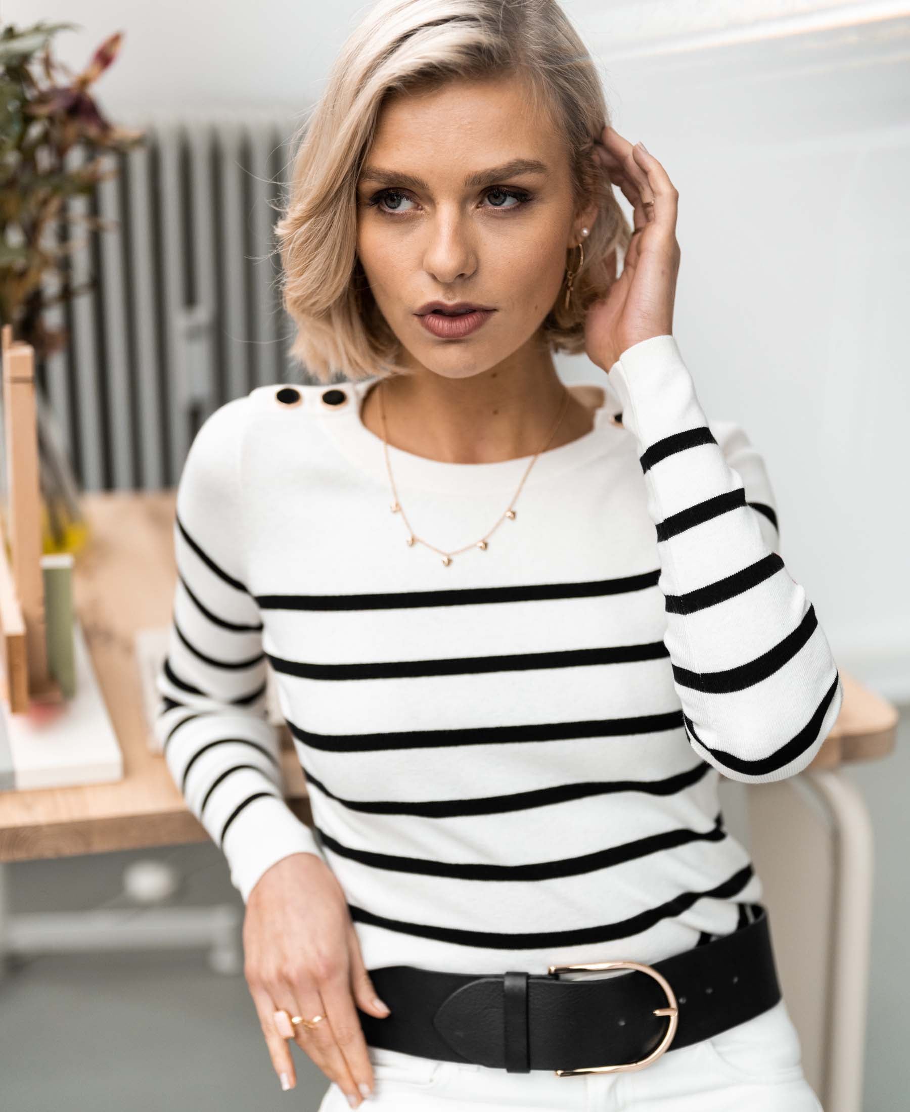 Ivory and black Breton sweater by PLEIN PUBLIQUE, shown indoors.