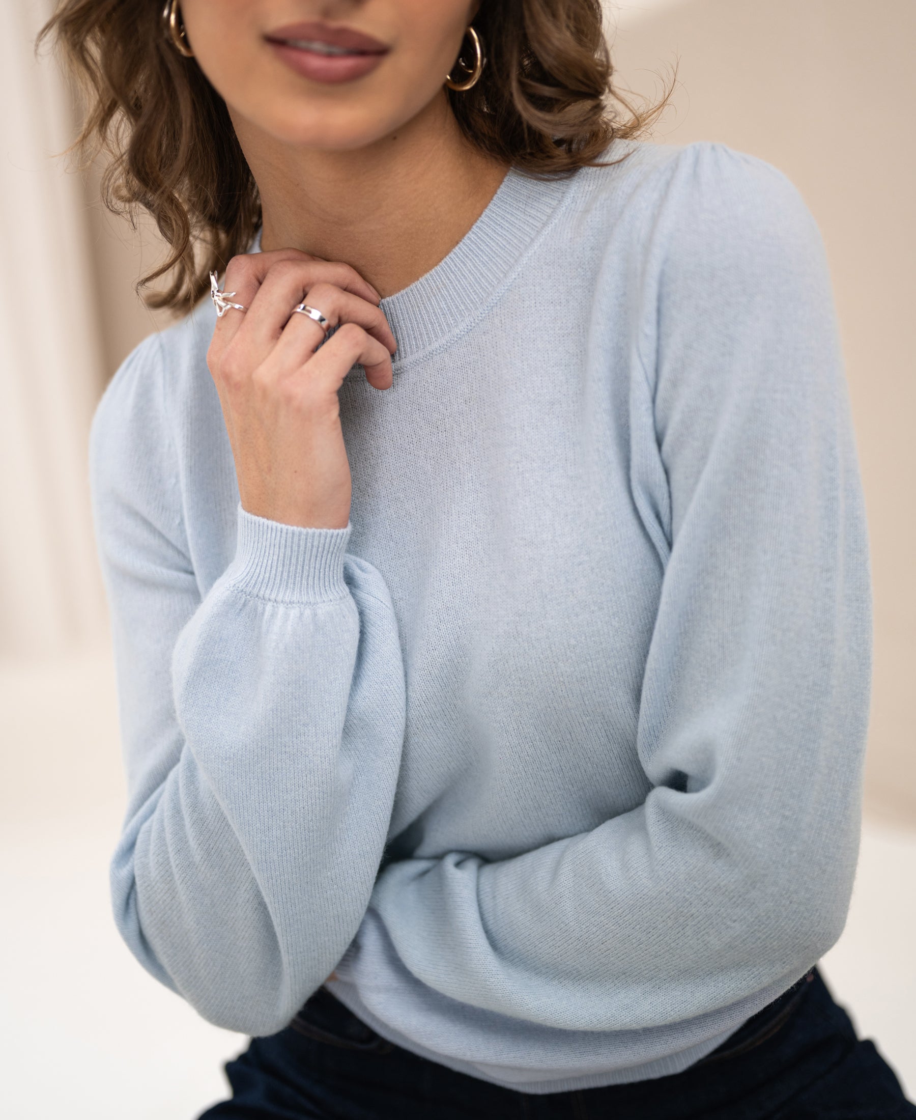 Light blue soft merino wool sweater by PLEIN PUBLIQUE, shown in soft lighting.