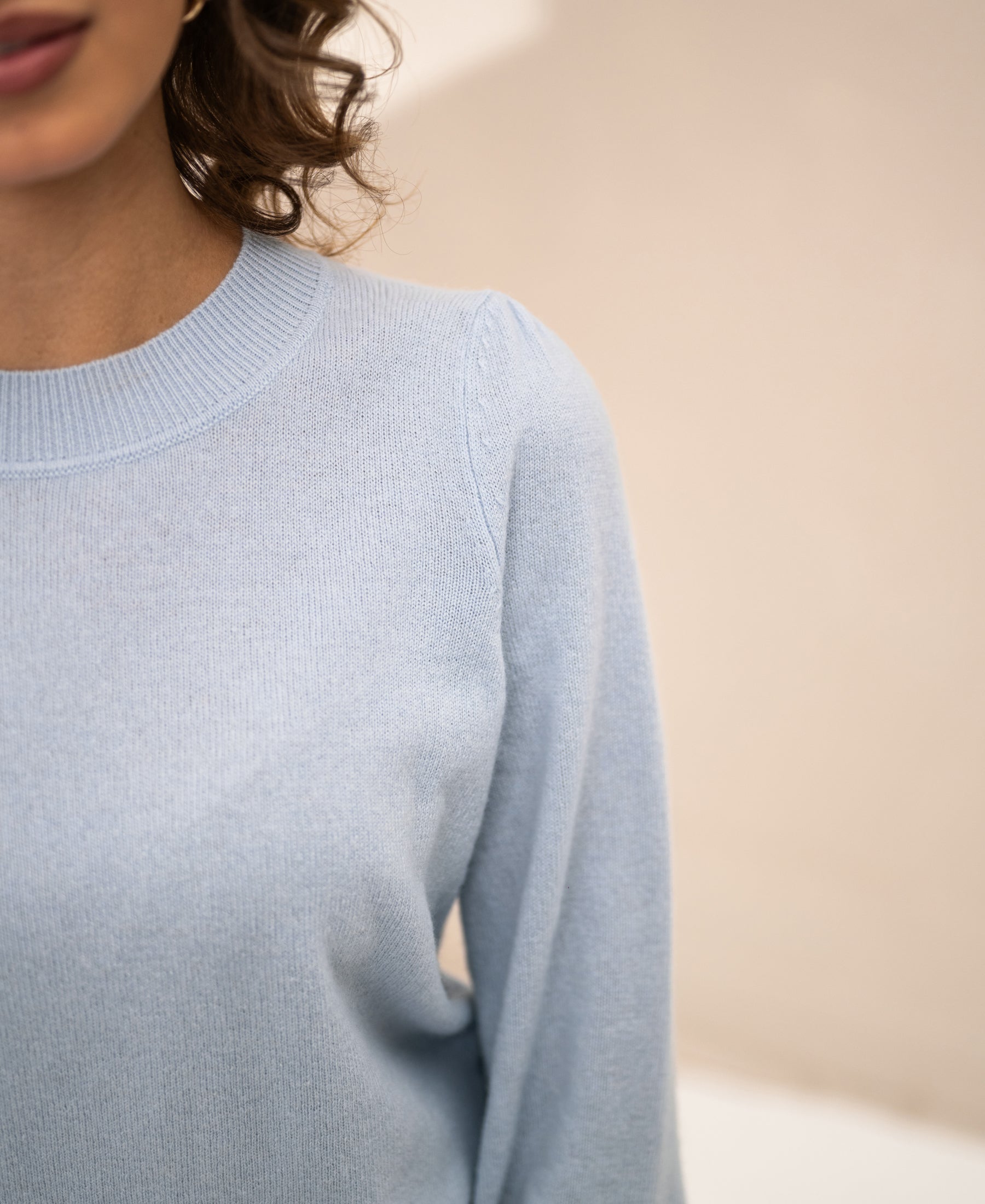 Light blue PLEIN PUBLIQUE LA BAYONNE soft merino sweater, shown with soft lighting and neutral background.