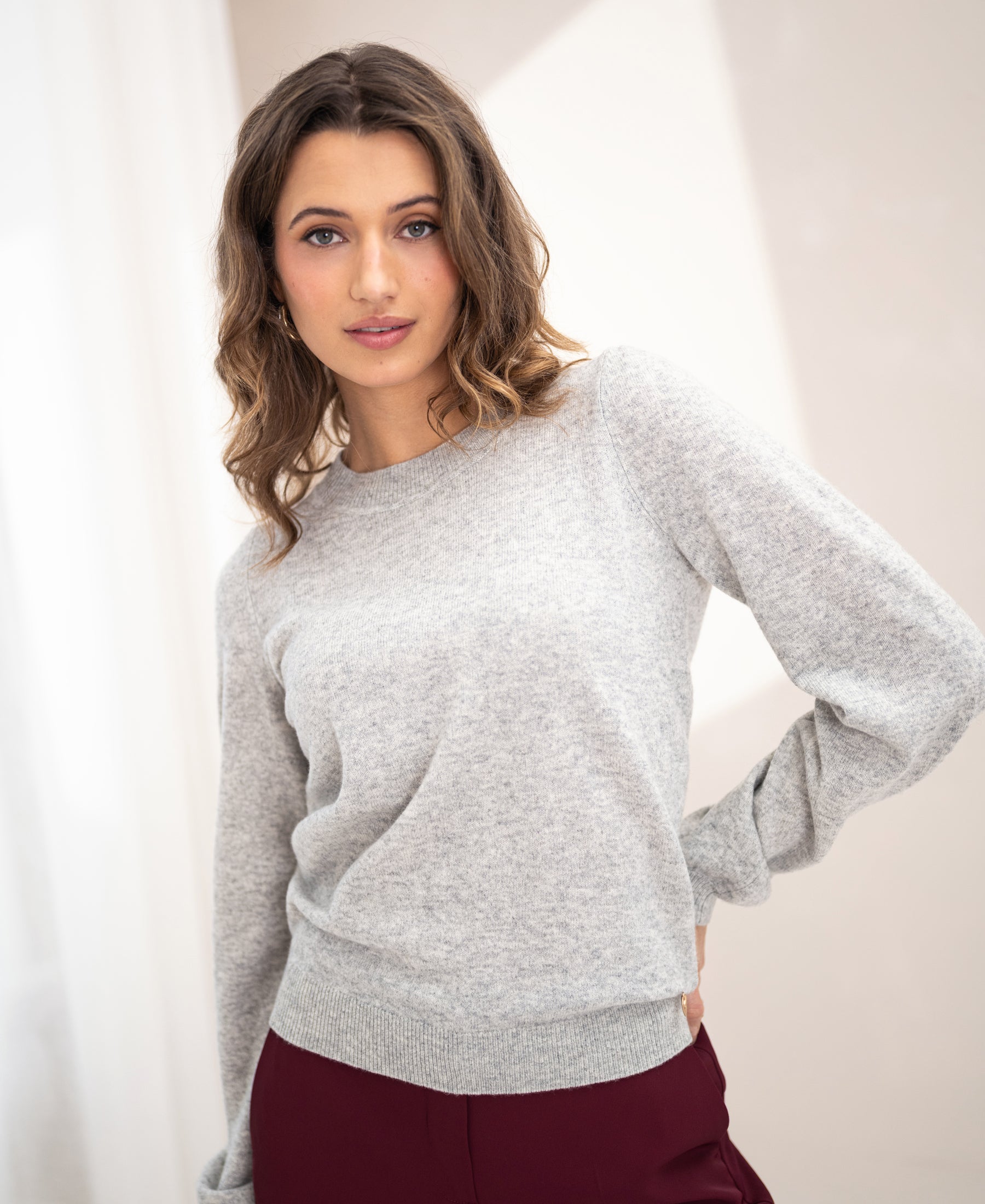 Light grey marl PLEIN PUBLIQUE soft merino wool sweater LA BAYONNE worn indoors.