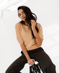 Soft salmon sweater, front view, on white background.