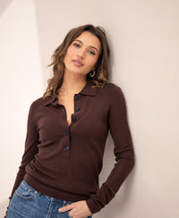 Merino wool polo shirt in cacao brown by PLEIN PUBLIQUE, called LE BOBIGNY, shown against a light wall.