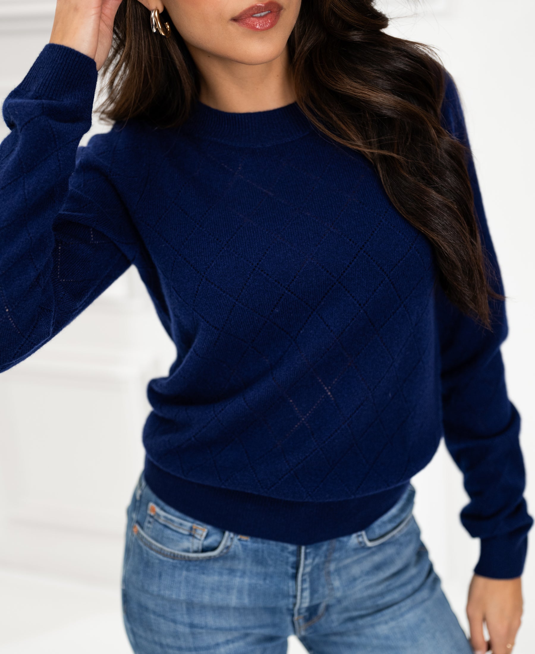 Navy argyle merino wool sweater LE CAMBRIDGE by PLEIN PUBLIQUE, shown indoors.