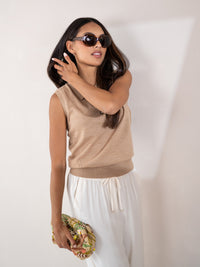 Sleeveless polo top in soft camel by PLEIN PUBLIQUE, shown on a woman.