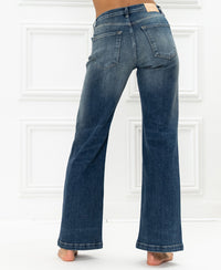 Blue vintage wide leg jeans by LES DEUX, shown from the back against a white background.