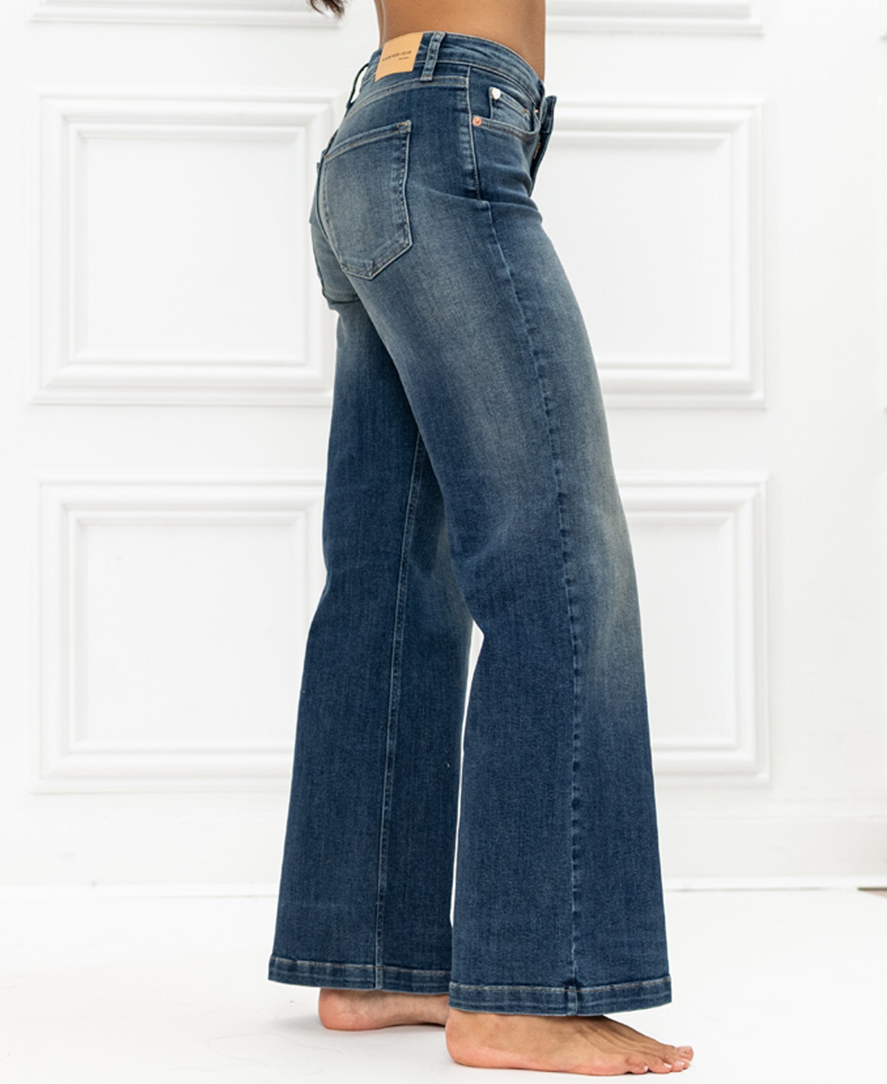 Wide leg jeans in blue vintage wash by LES DEUX, shown against a white paneled background.