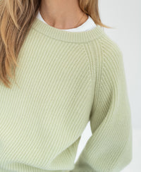 Light green merino wool sweater shown from the front.