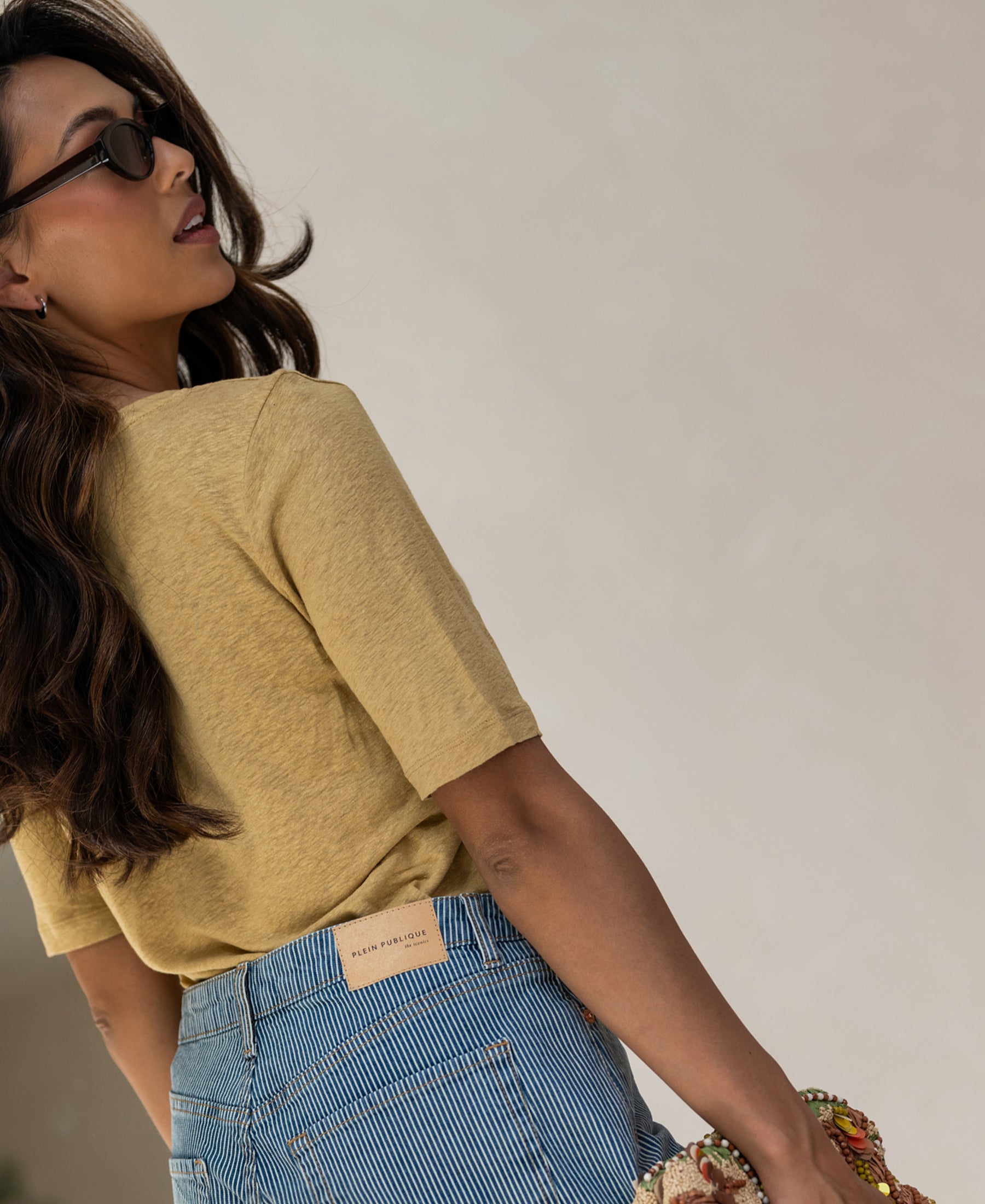 Mustard yellow linen T-shirt, side view.