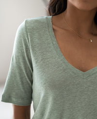 Mistygreen linen T-shirt from PLEIN PUBLIQUE, shown worn by a woman.