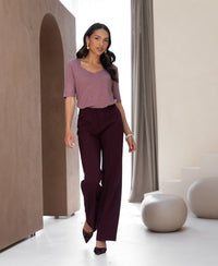 Mauve linen t-shirt in a minimal, neutral-toned room.