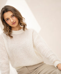 Ivory white mohair sweater by PLEIN PUBLIQUE, shown in bright light.