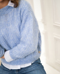 Light blue mohair sweater with a small heart detail.