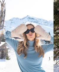 Woman wearing blue merino wool turtleneck sweater, front view.