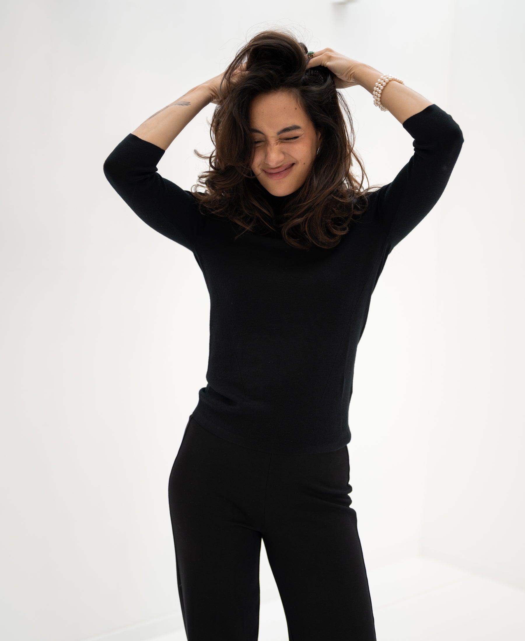 Black LE FABIAN turtleneck sweater by PLEIN PUBLIQUE shown against a white background.