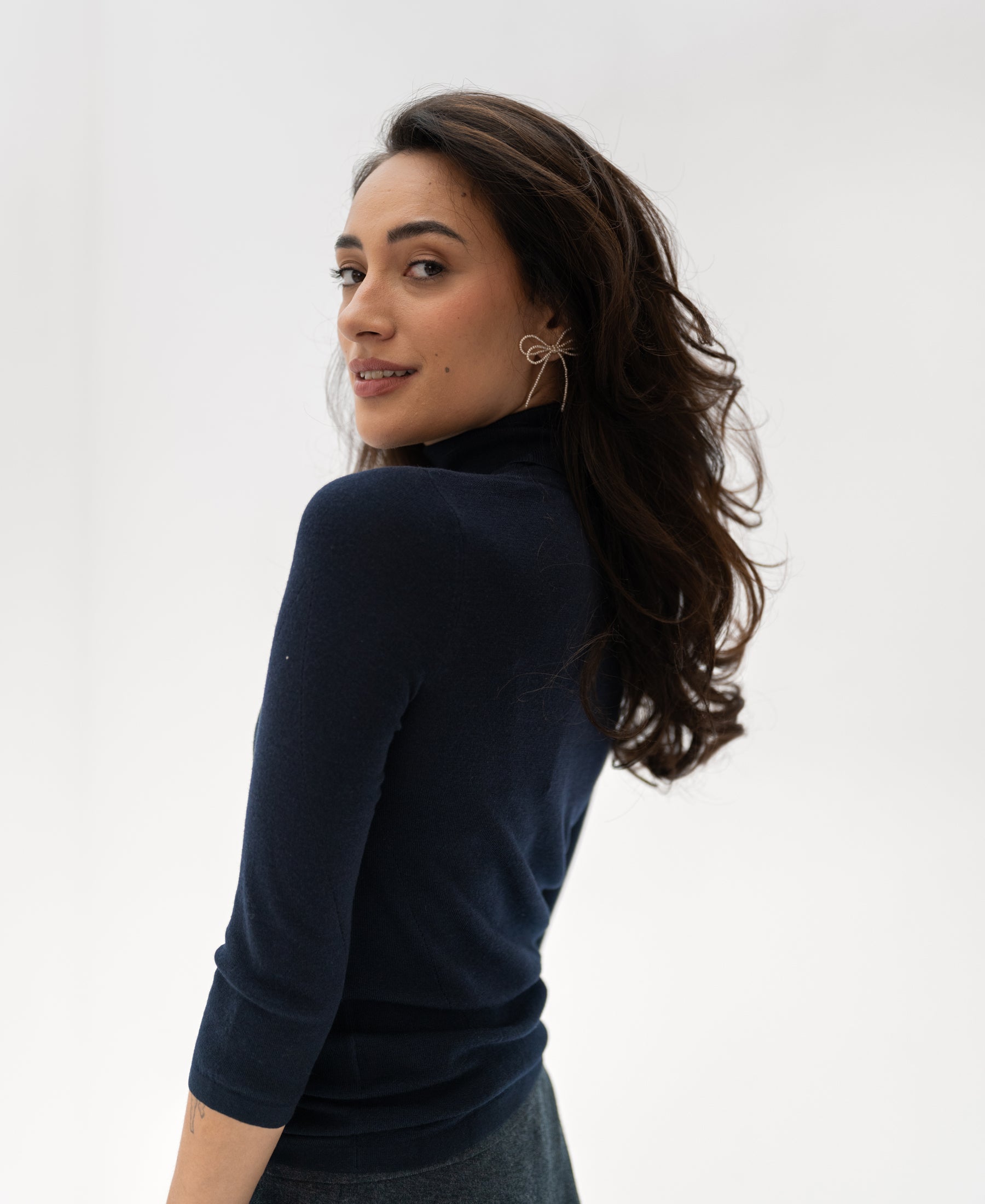 Navy blue turtleneck sweater by PLEIN PUBLIQUE, LE FABIAN style, shown from the back.