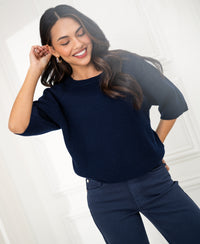 Navy blue PLEIN PUBLIQUE LA FRAMBOISE sweater shown in a bright room.