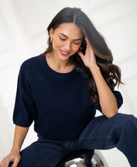 Navy PLEIN PUBLIQUE LA FRAMBOISE sweater, shown indoors.