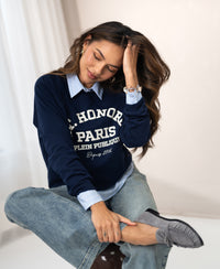 Woman wearing the PLEIN PUBLIQUE LA HARPER dark blue sweater.
