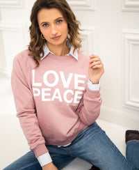 Antique rose LOVE PEACE sweater in soft knit with text detail, front view.