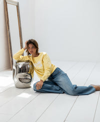 Yellow LA HARPER sweater by PLEIN PUBLIQUE displayed against a white floor.